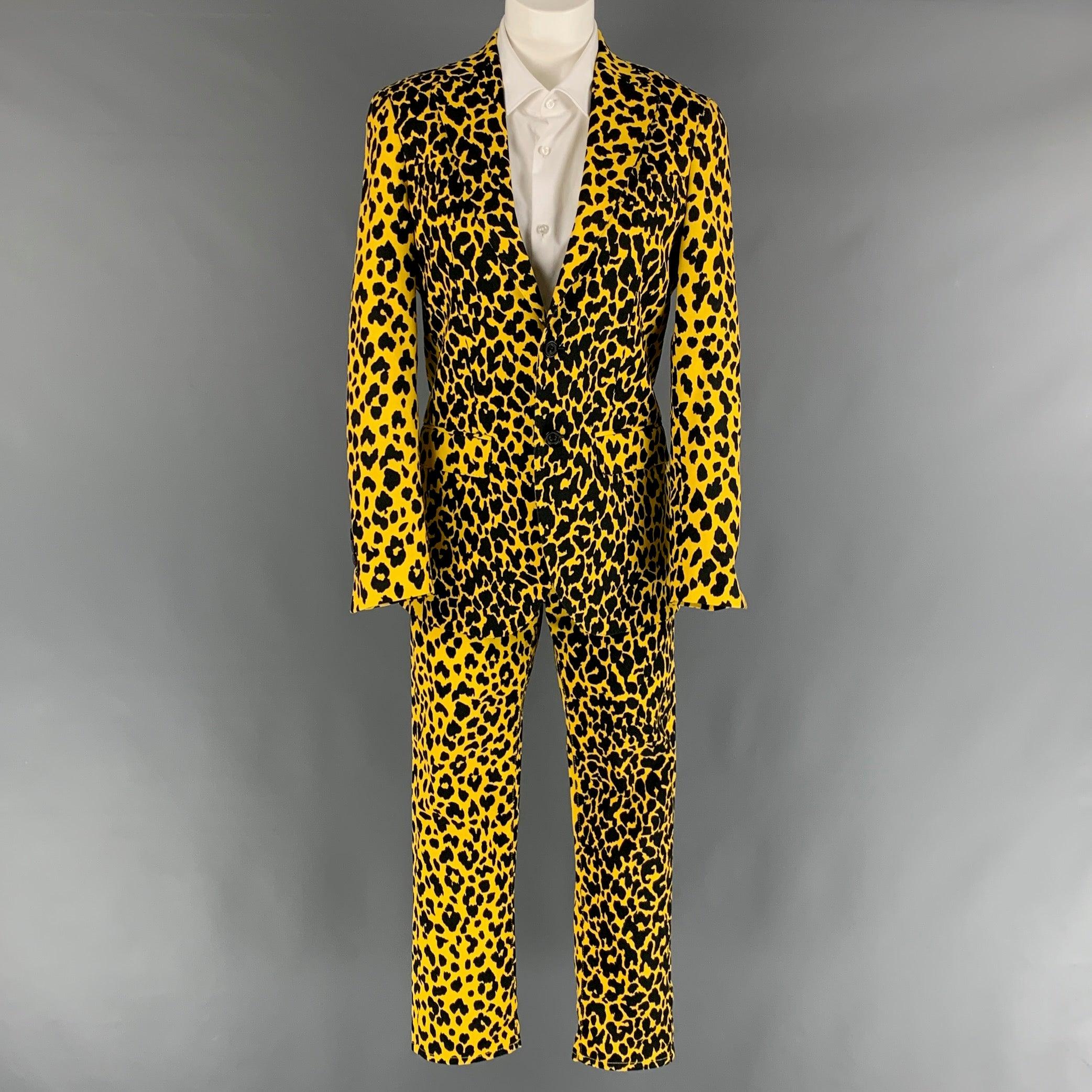 R13 suit comes in a black & yellow bold leopard animal print cotton twill with a no liner and includes a single breasted, double button sport coat with a notch lapel and matching denim style trousers. Made in USA.Excellent Pre-Owned Condition. 