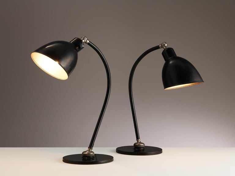Christian Dell for Kaiser Idell, desk lights, aluminum, black lacquered metal, Germany, 1930s

Wonderful Bauhaus desk lights designed by Christian Dell for Kaiser Idell in the 1930s. This delicate pair of table lamps of German origin embodies a
