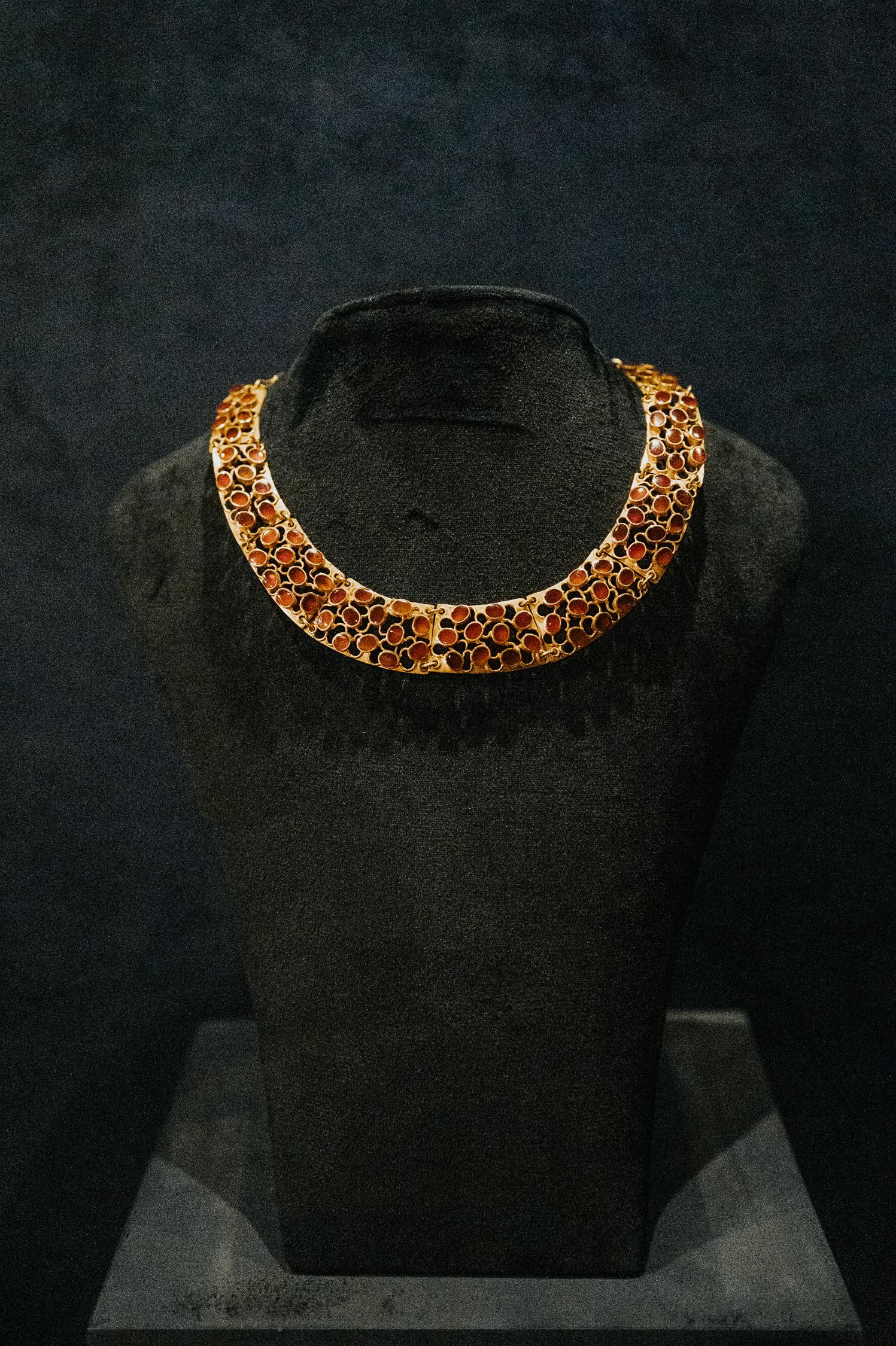 Reproduction of Ancient Egyptian Jewelry & traditional techniques preserved by artisans 
Origin: Saqqara, Egypt 
Design of  Piece: Ancient Egyptian collar necklace/ choker
Symbols Depicted in Piece: Circular Shapes
Material & Precious Stones:  18k