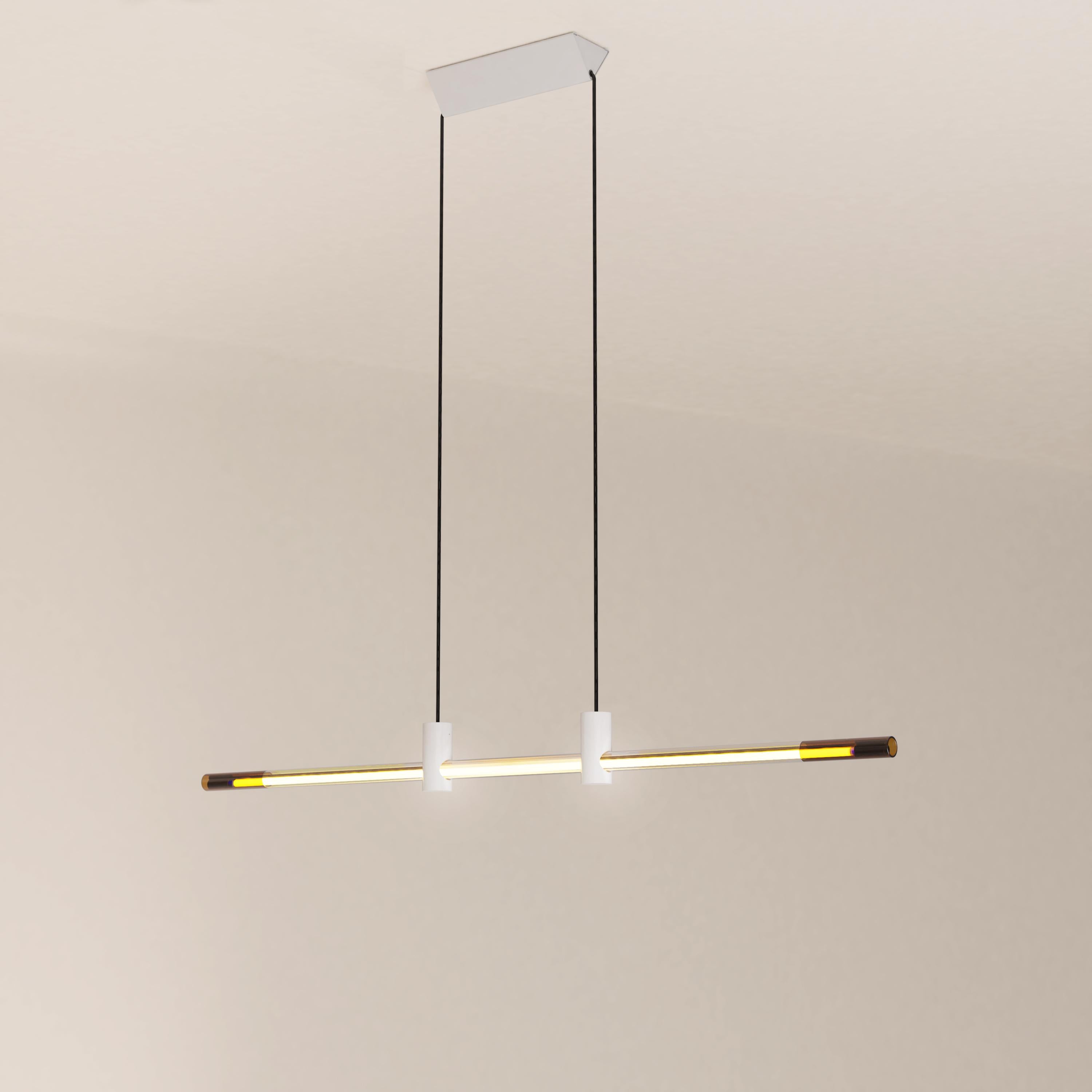 The Ra Line in its glossy white painted finish is a contemporary hand-blown glass and aluminum pendant lighting with cold cathode neon.

The Ra Line is distinguished by a marked opposition between heaviness and lightness. The assemblage of the
