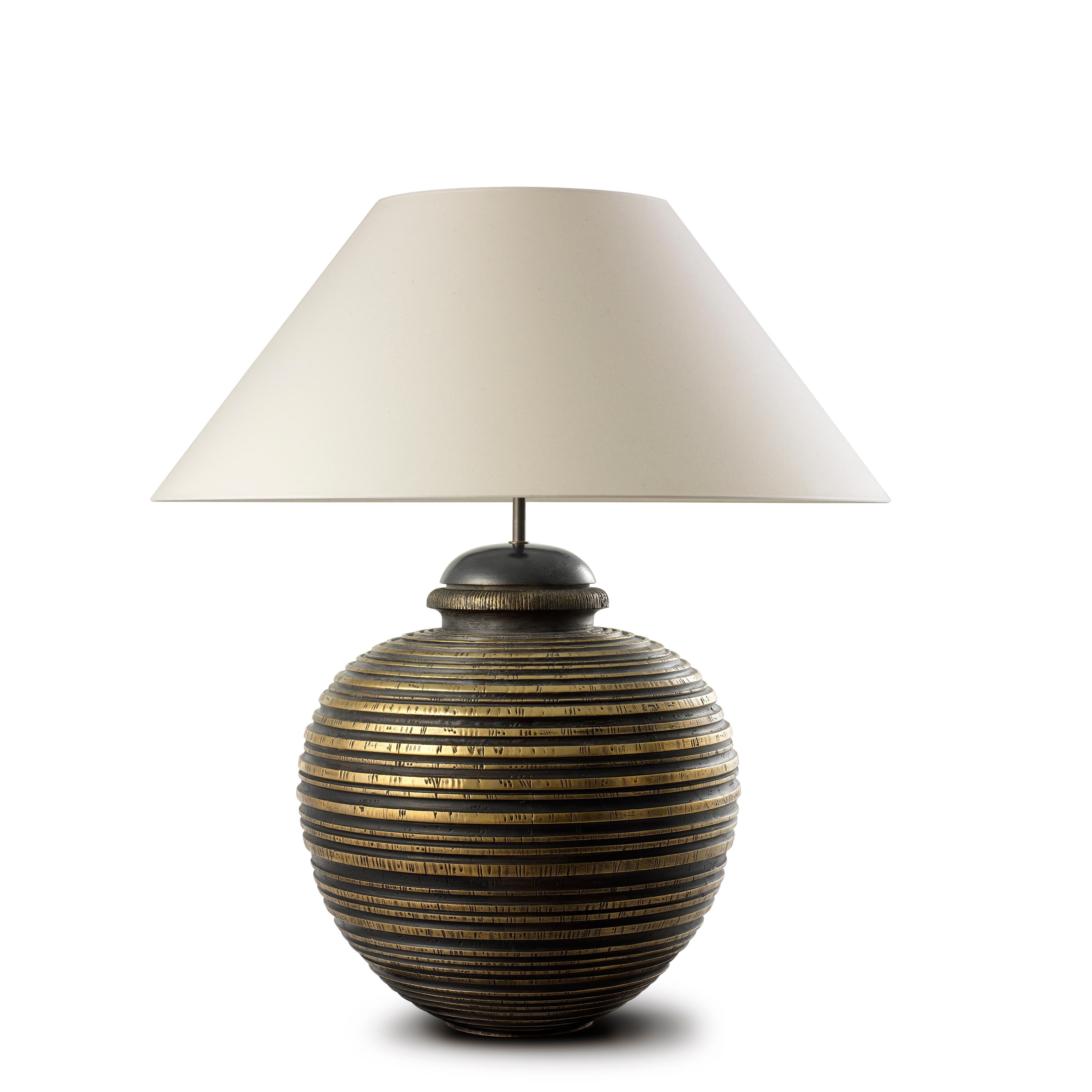 Contemporary Art Deco design handmade and hand-finished table lamp. We combine skilled craftsmanship with the finest materials to give shape to our designs. Its artisan finish makes each piece different from the other and easy to customize. Each