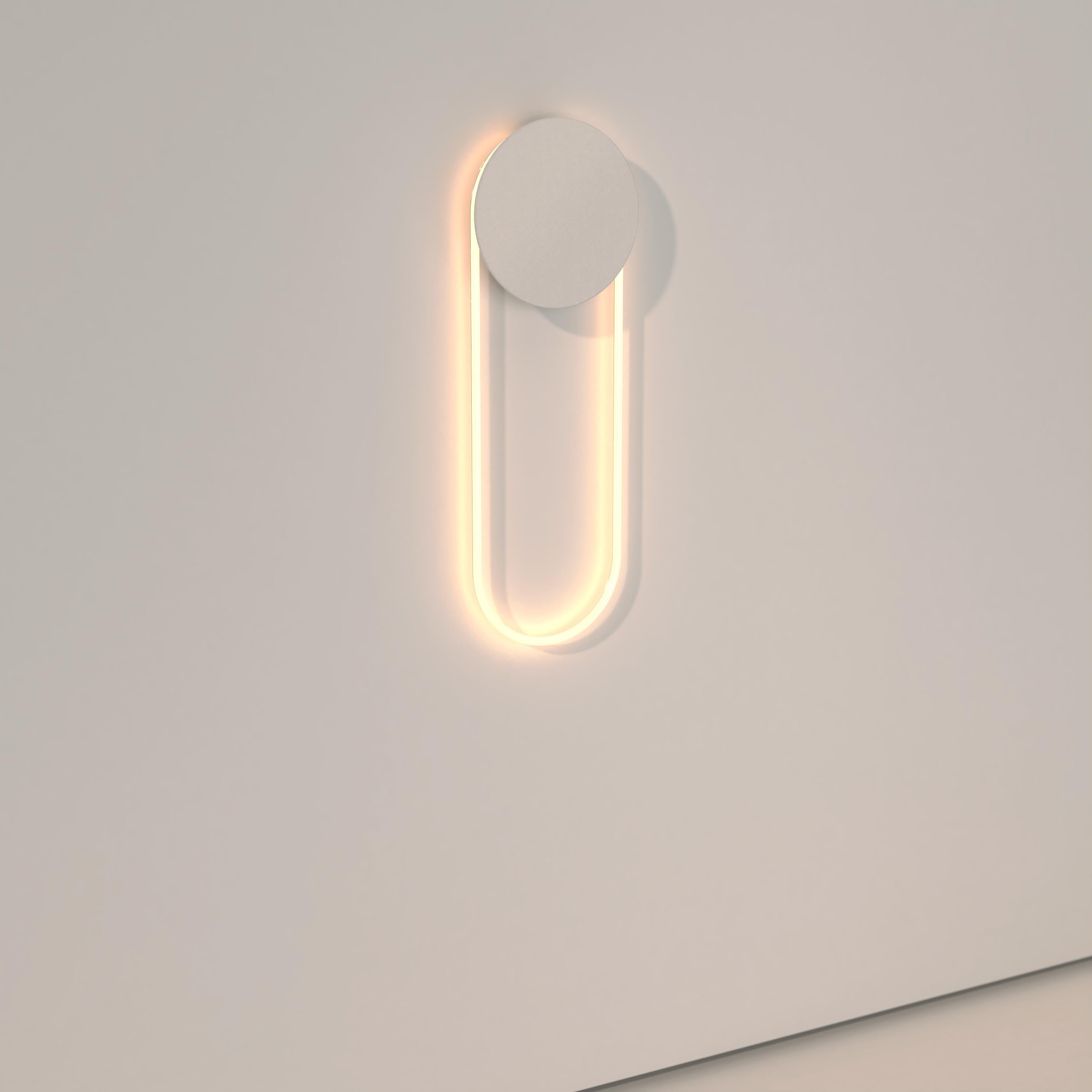 The Ra Wall is a modern and hypnotic wall sconce lighting made with a cold cathode neon and a circular disc available in diverse finishes.

RA Wall participates in its surroundings by playing with contrasts, shadows and reflections. The circular