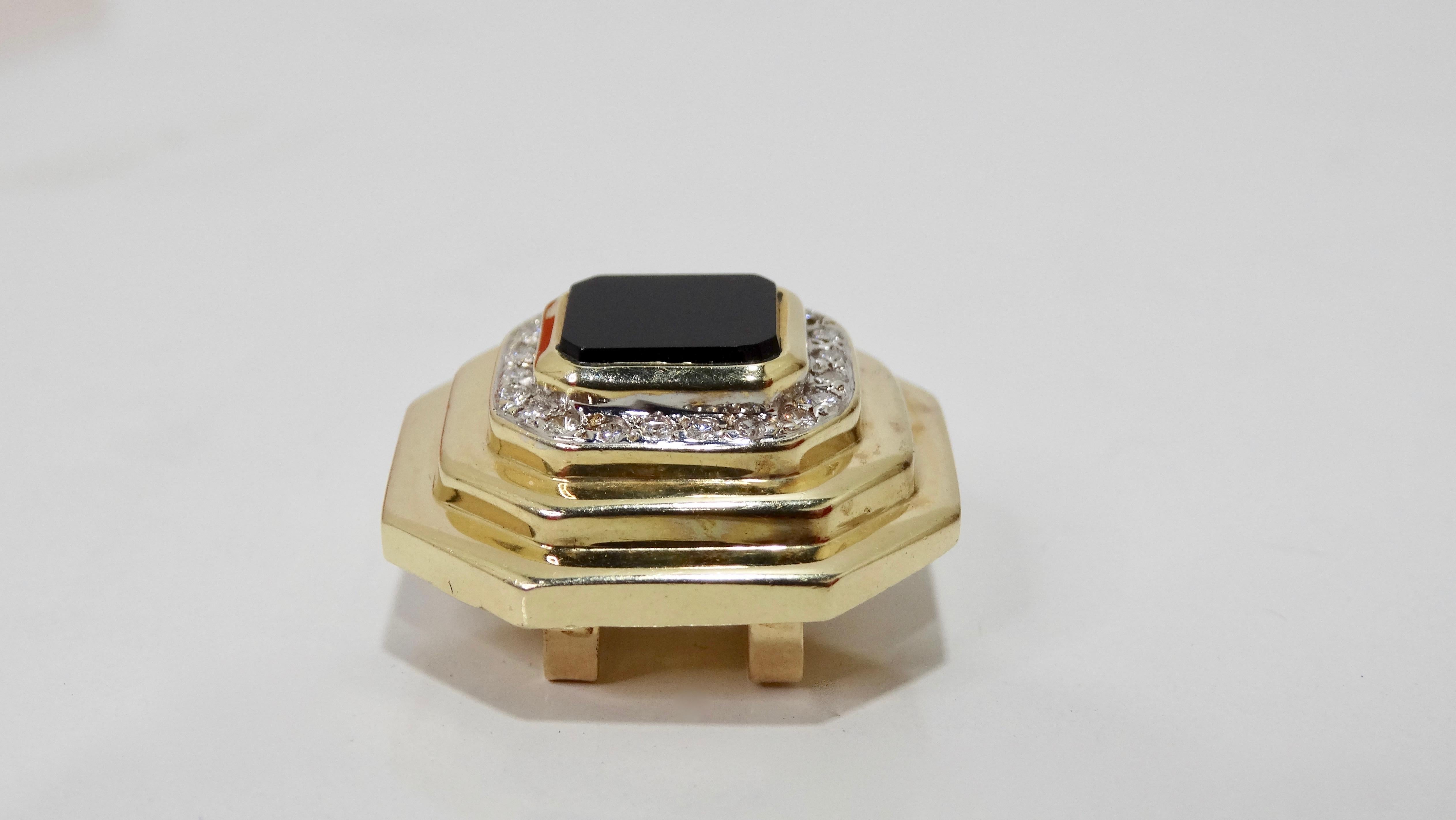 Elevate your look with this stunning Raafty pendant! Circa 1980s, this pendant is crafted from 14k gold and features a step cut octagon shape with 22 VS Diamonds and an Onyx center stone. Elegant and chic, this piece can be worn on a necklace or as