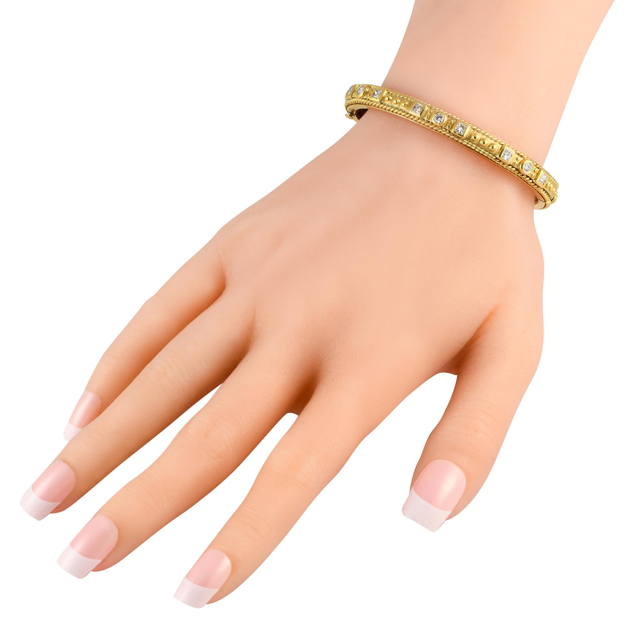 A weighty, tactile, and charming piece of jewel to bring interest to your looks. This hinged bangle bracelet from Raafty is made of 18K yellow gold and has a slender profile. The edges feature a rope-style border while the middle surface displays a