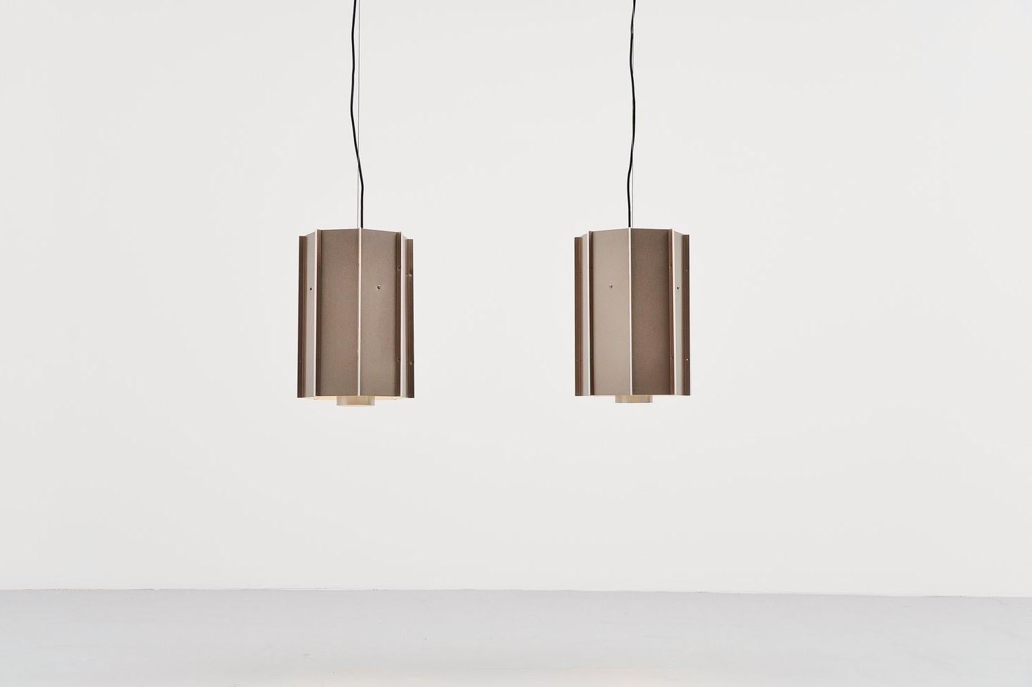Large lot of ceiling lamps model B1011 designed and made by Raak Amsterdam, The Netherlands 1970. These lamps have a copper colour shade and between the layers there is plexiglas for a very nice light effect when lit. The lamps have a round diffuser