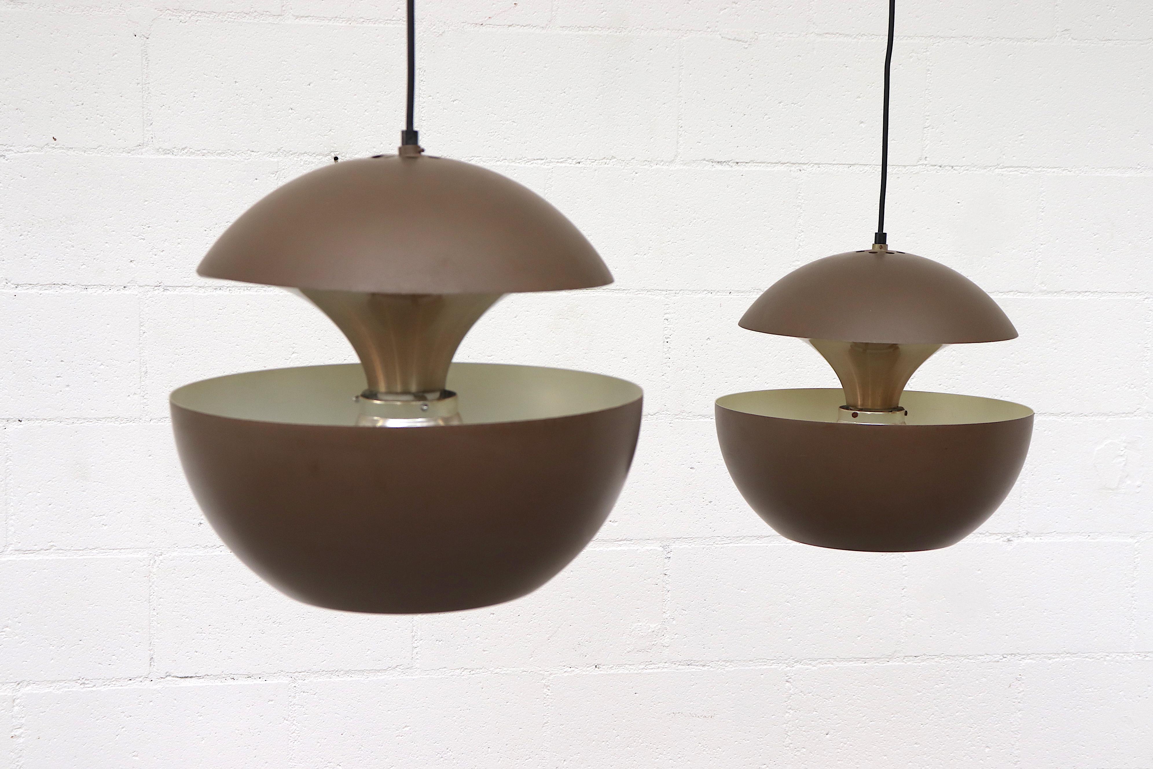 RAAK 'Springfontein' ceiling pendant with brown enameled aluminum shade on aluminum hardware with sleek modern design. In overall good original condition with visible wear and scratching consistent with age. May have some denting. Individually