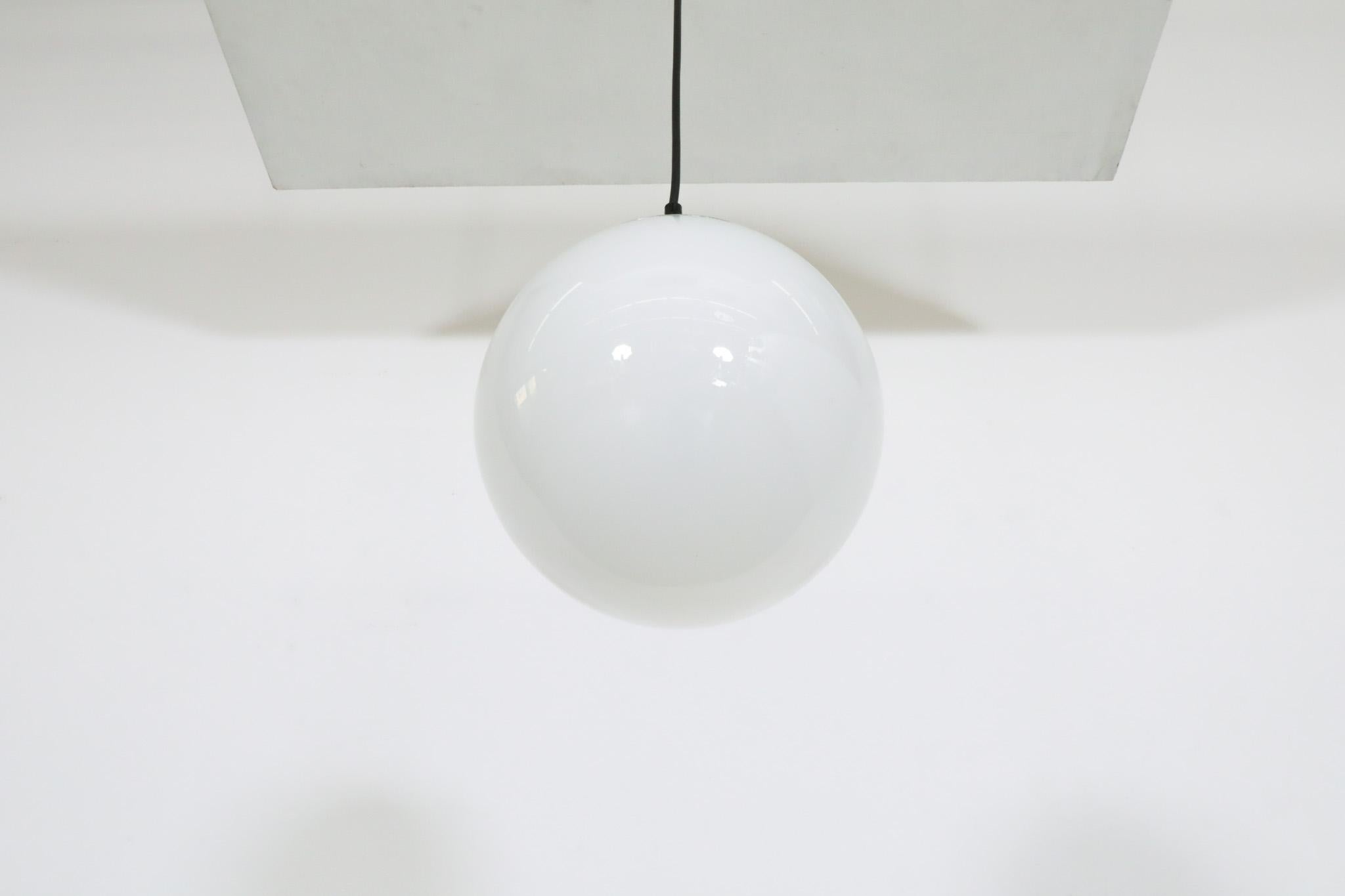RAAK (attr) Opaline Glass Globe Pendant Lights with chrome hardware For Sale 1