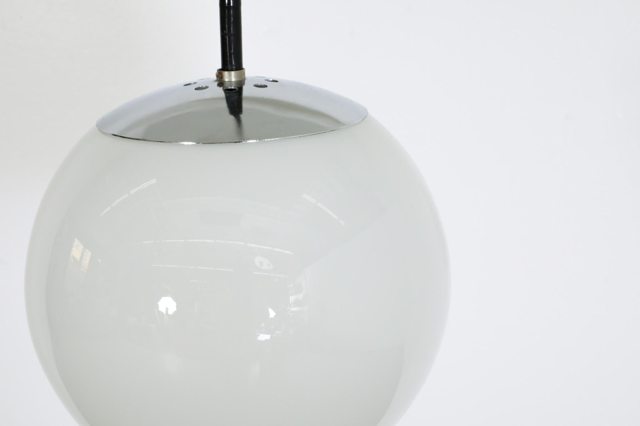 RAAK (attr) Opaline Glass Globe Pendant Lights with chrome hardware For Sale 2