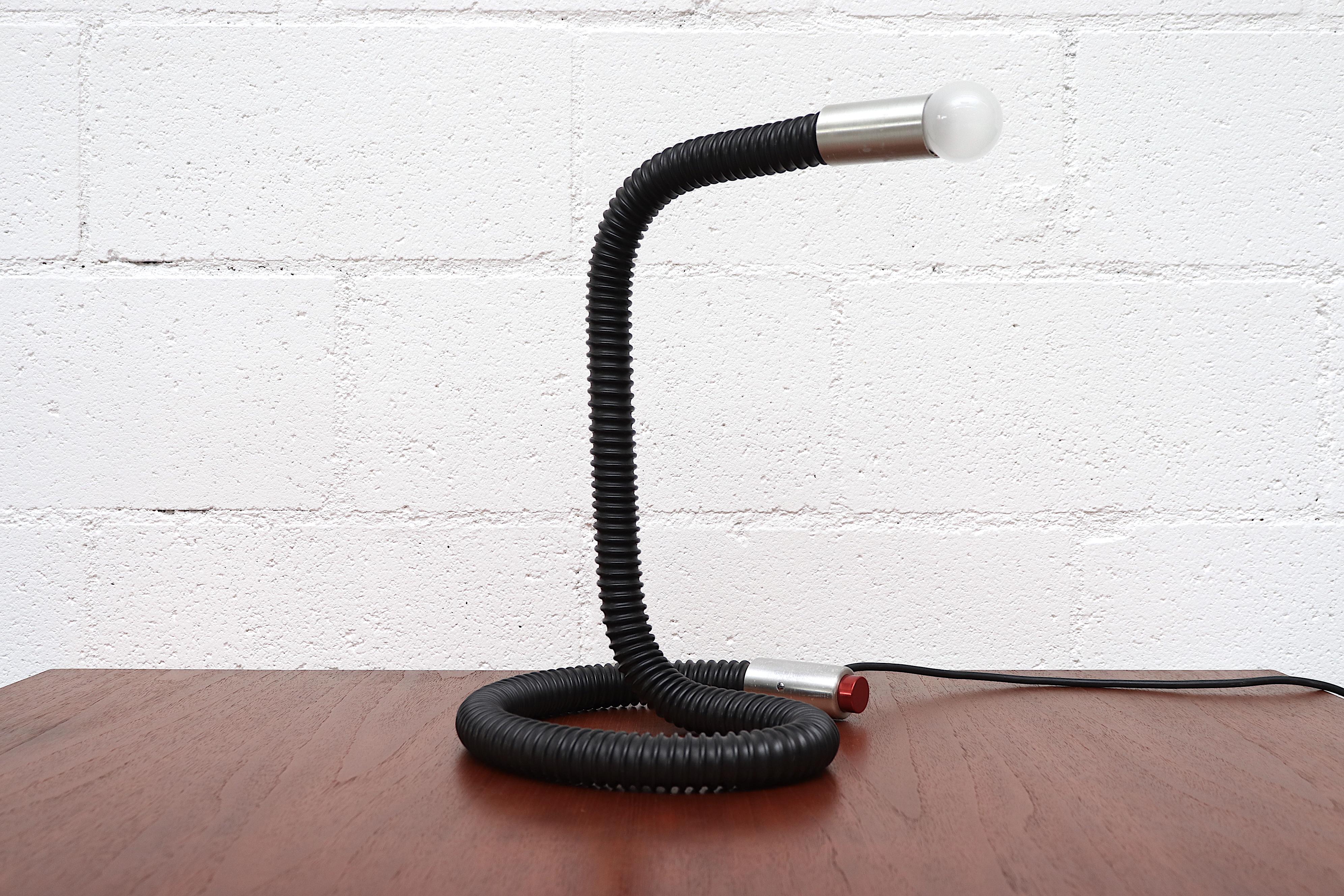 MOD RAAK Goose neck desk lamp with cobra-like non-flexible body and original European candelabra socket. Red push button light switch. In original condition with normal wear and original European plug.