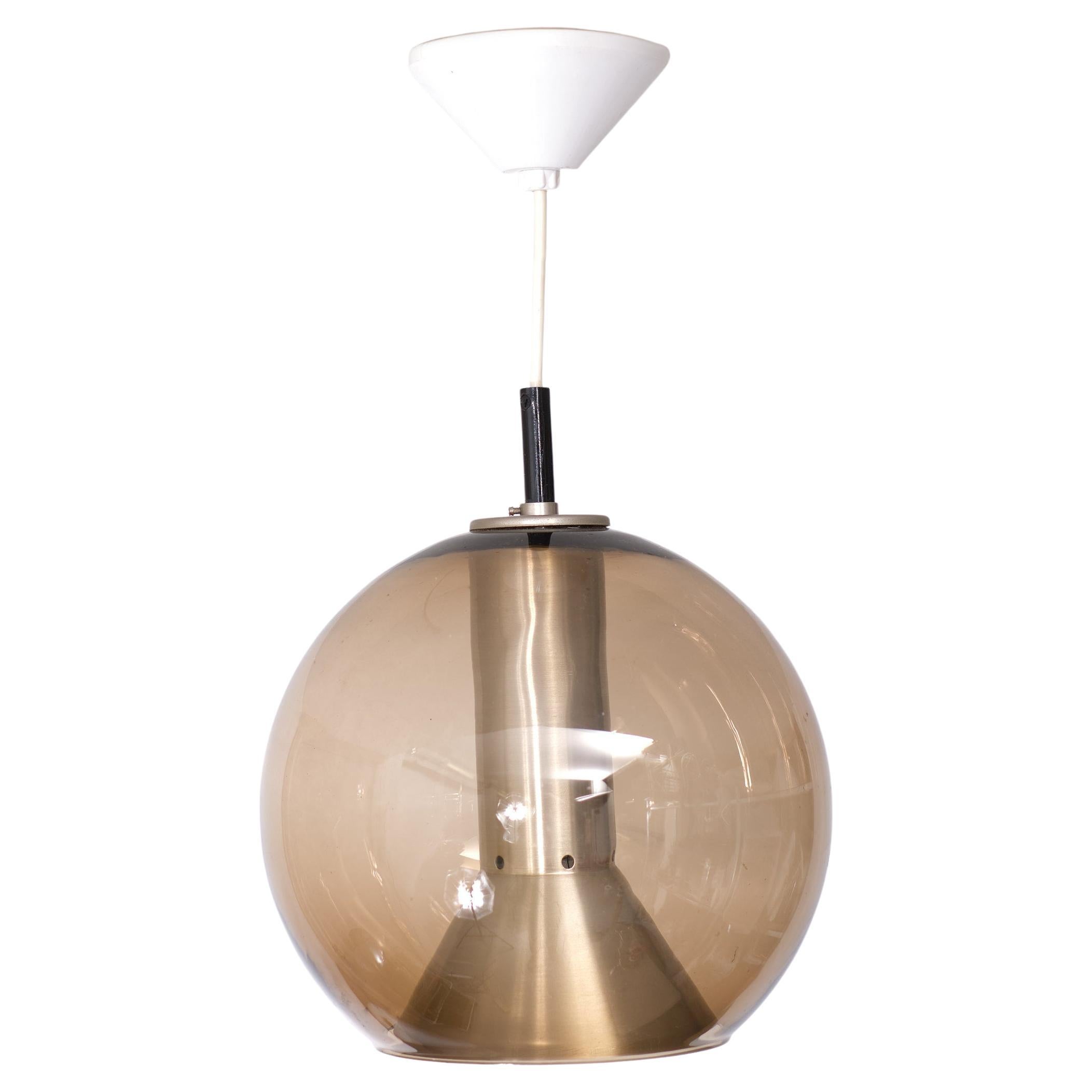 Crystal brown smoked glass sphere lampshade. Aluminum conical reflector-diffuser and lampshade holder E27 socket. Designer: Frank Ligtelijn (1933-1996). For Raak Amsterdam 
model Globe. Late 1950s.