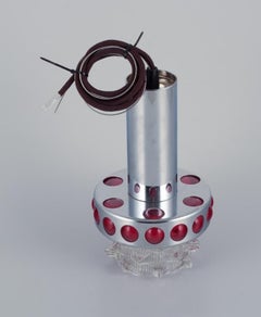 RAAK, Holland. Designer lamp in chrome, red plastic, and clear glass.