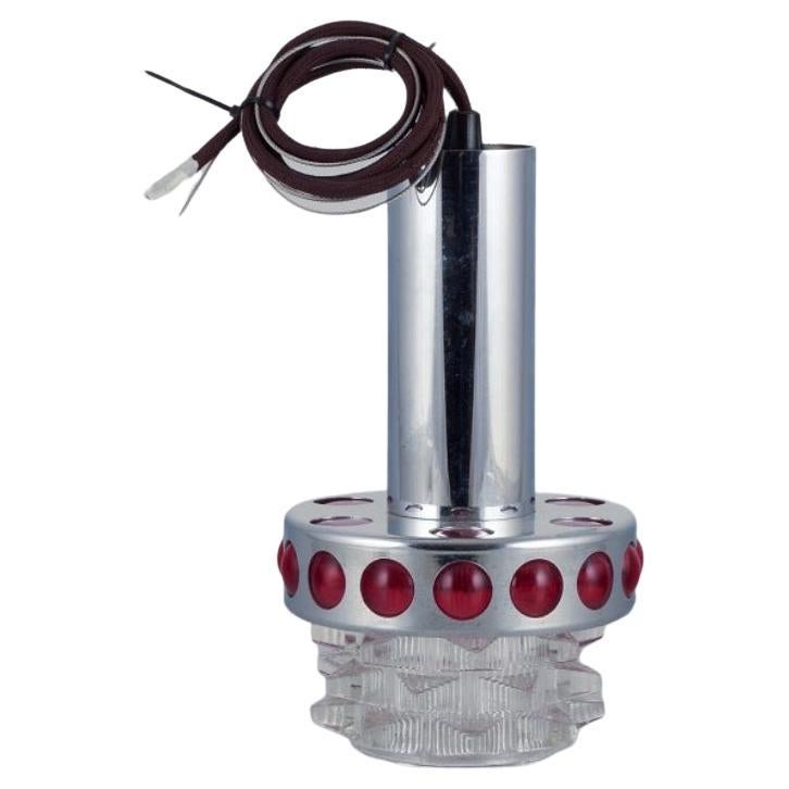 RAAK, Holland. Designer lamp in chrome, red plastic, and clear glass.