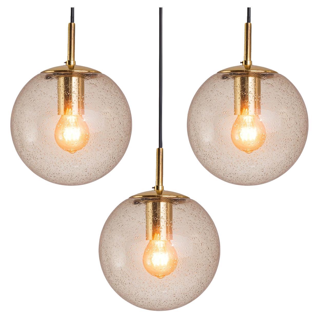 RAAK Pendants in Smoked Pulegoso Glass and Brass  For Sale