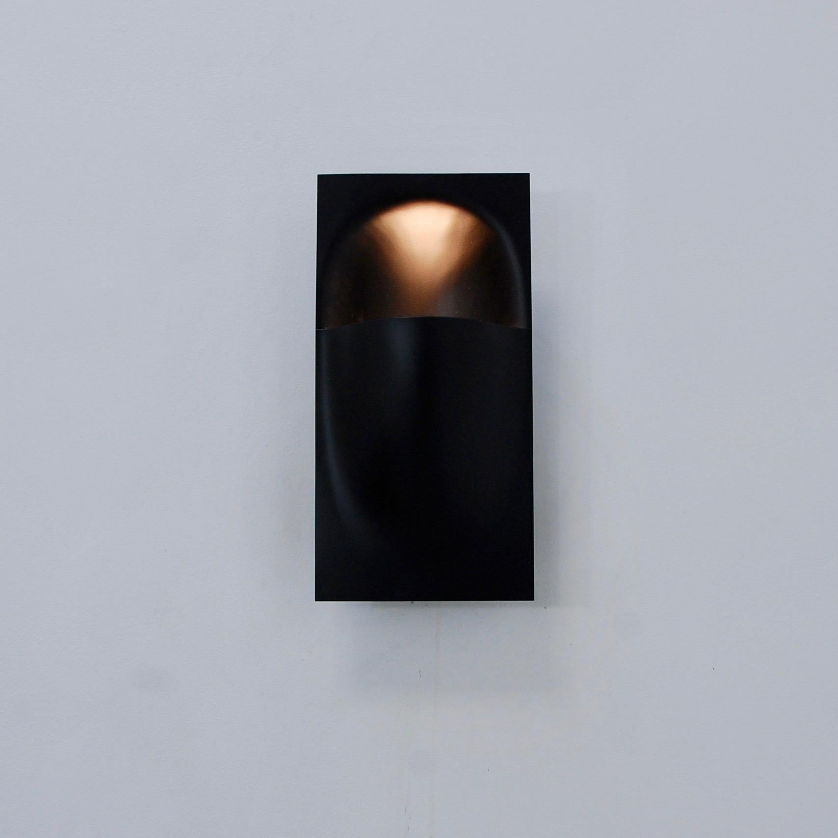 A pair of modern sconces by Bertrand Balas for RAAK, Amsterdam. Can be used either indoor or outdoor (if placed in a fully covered area). Partially restored. Painted steel finish. Single E26 based socket per sconce. Maximum wattage 75 watts per