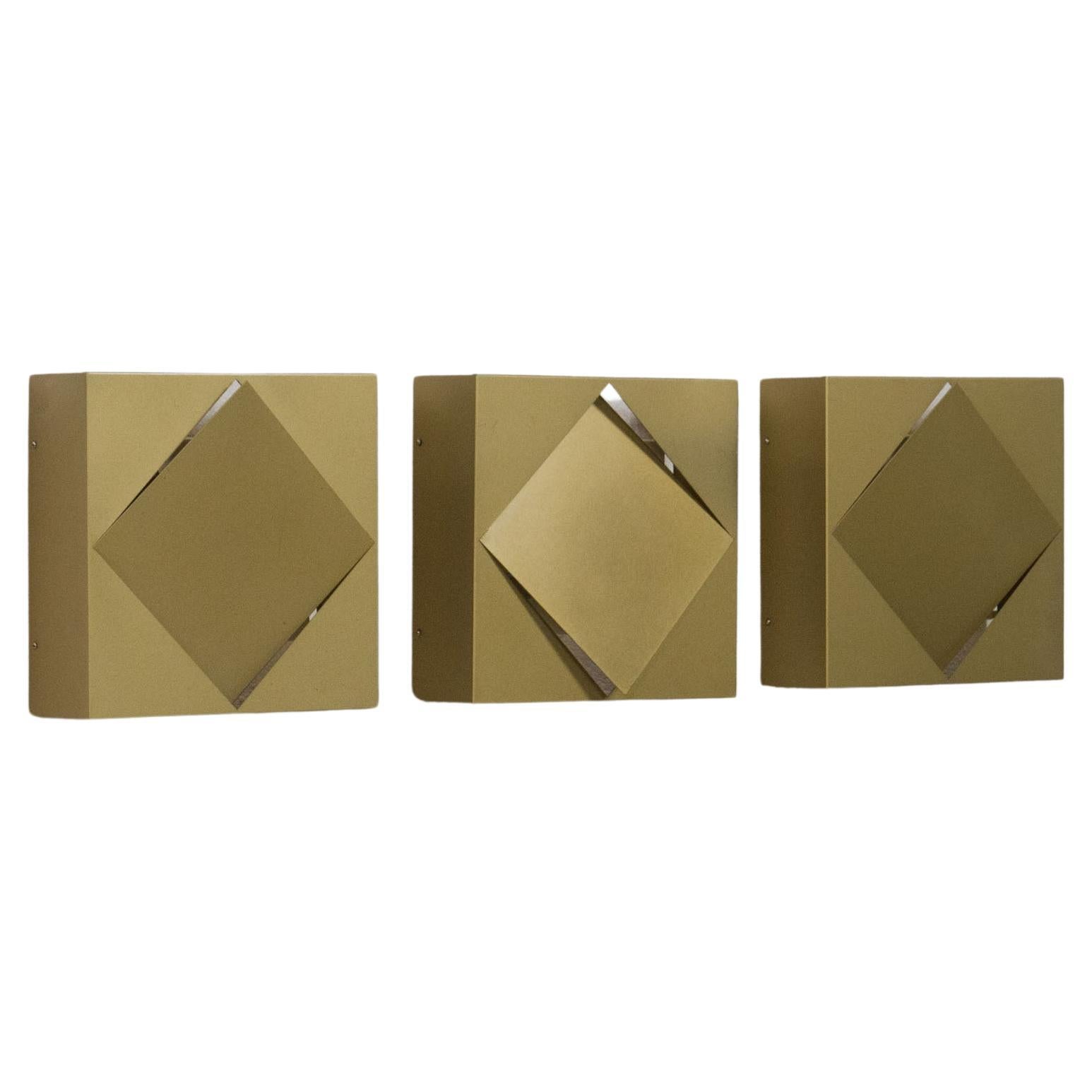 Raak set of three ‘C-1556’ gold/green wall lamps For Sale