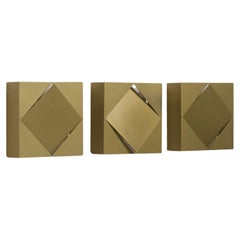 Raak set of three ‘C-1556’ gold/green wall lamps