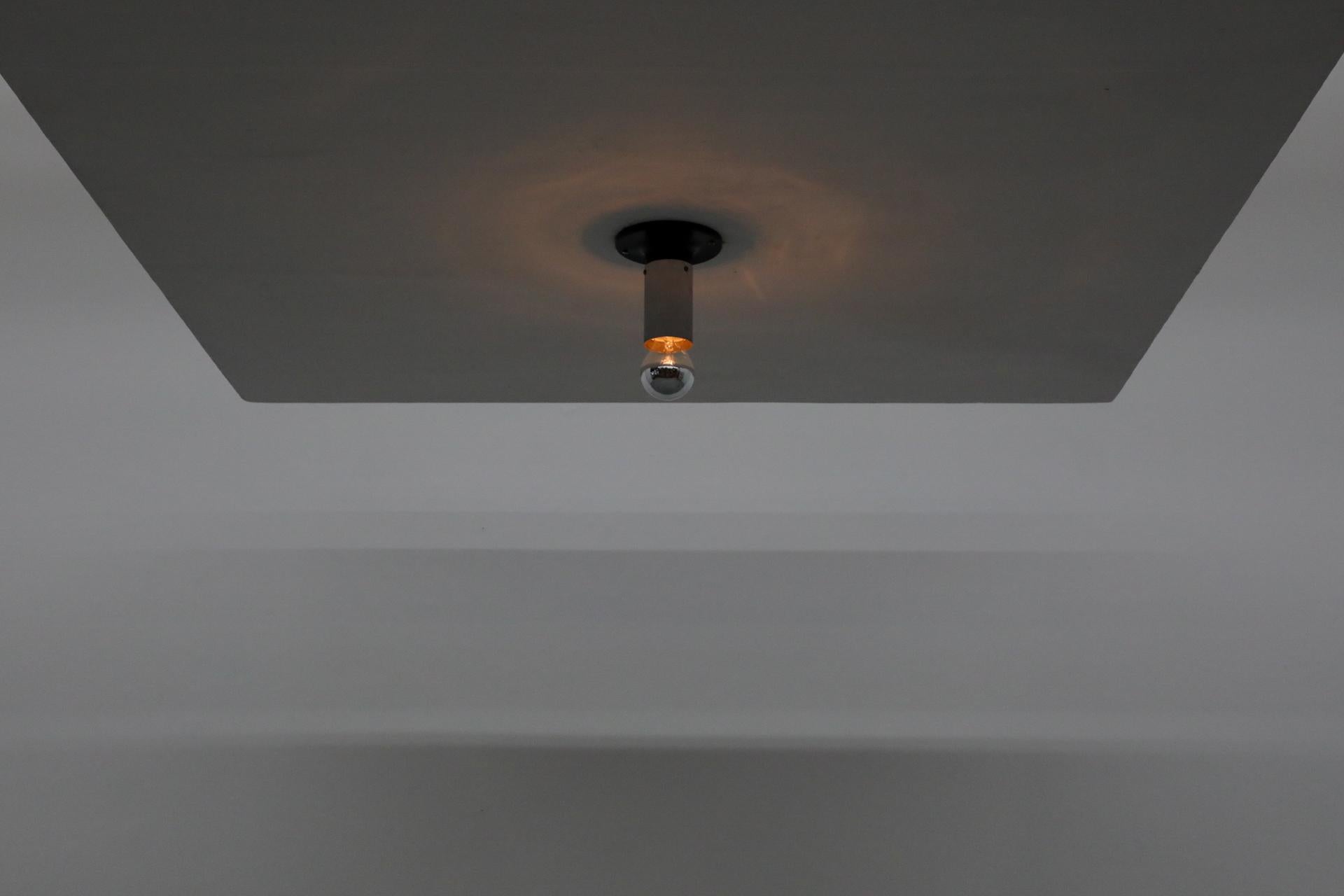 RAAK medium Maxibule chrome ceiling lights with chrome stem and black enameled metal base. In original condition with visible wear consistent with age and use. Shown with chrome tipped, medium base light bulbs. Small and large sizes also available,
