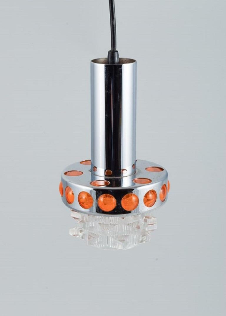 RAAK, The Netherlands. Designer lamp in chrome, orange plastic and clear glass.
Approx. 1970s.
In excellent condition.
Measurements: H 25.0 x D 15.0 cm.