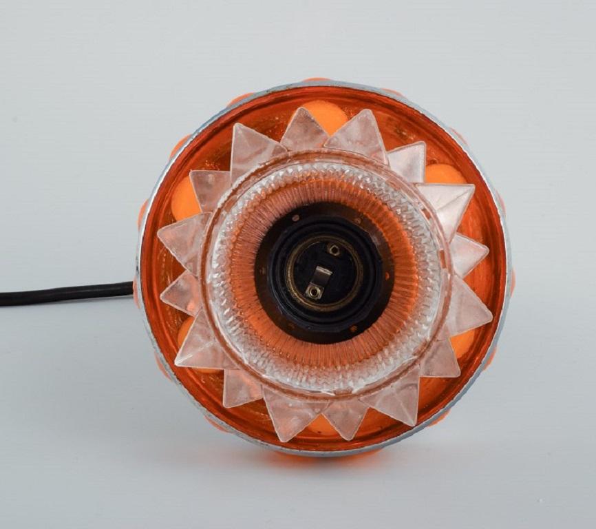 Late 20th Century RAAK, The Netherlands. Designer Lamp in Chrome, Orange Plastic and Clear Glass For Sale