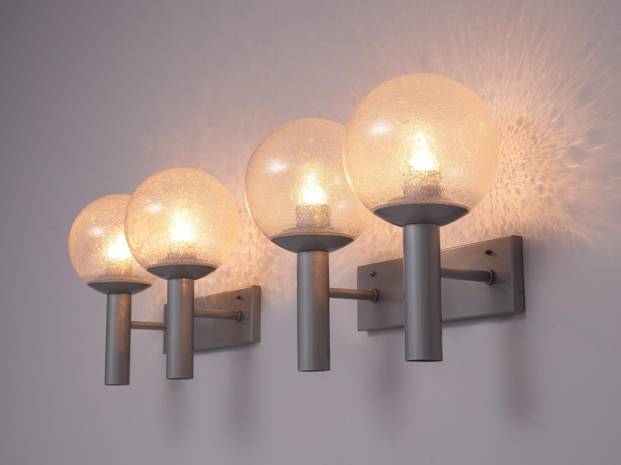 RAAK, wall sconces, model 'C-1663' Vigilante, metal, glass, Europe, 1960s.

These lights have a simplistic design. Its strength is in the combination of the forms and materials. The fixture consists of a plate to which two tubes are connected that
