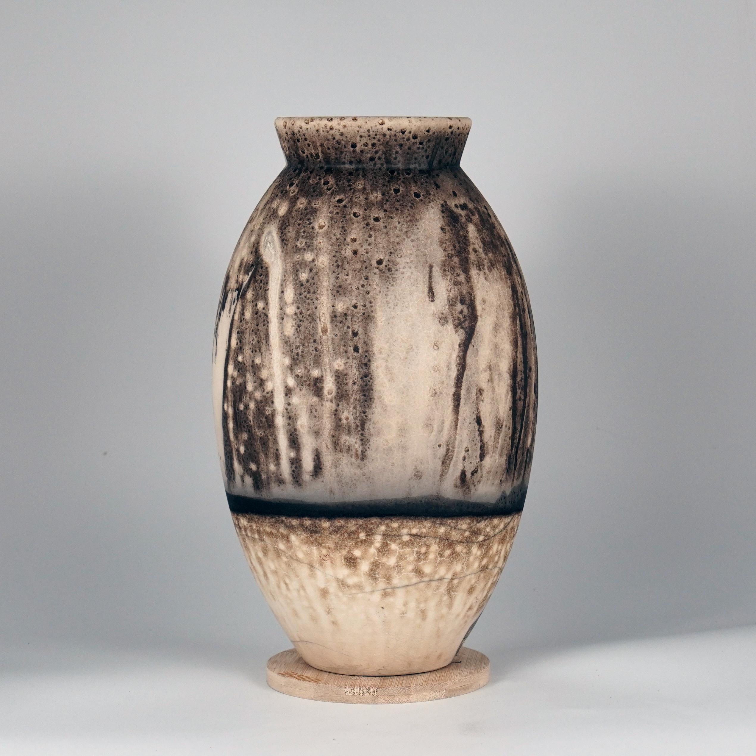 The Oval Vase is a tall, teardrop-shaped design best for adding a touch of elegance and intrigue to an interior space. Made using the Raku technique, it easily becomes a great conversation starter.

Obvara is a firing technique similar to the Raku