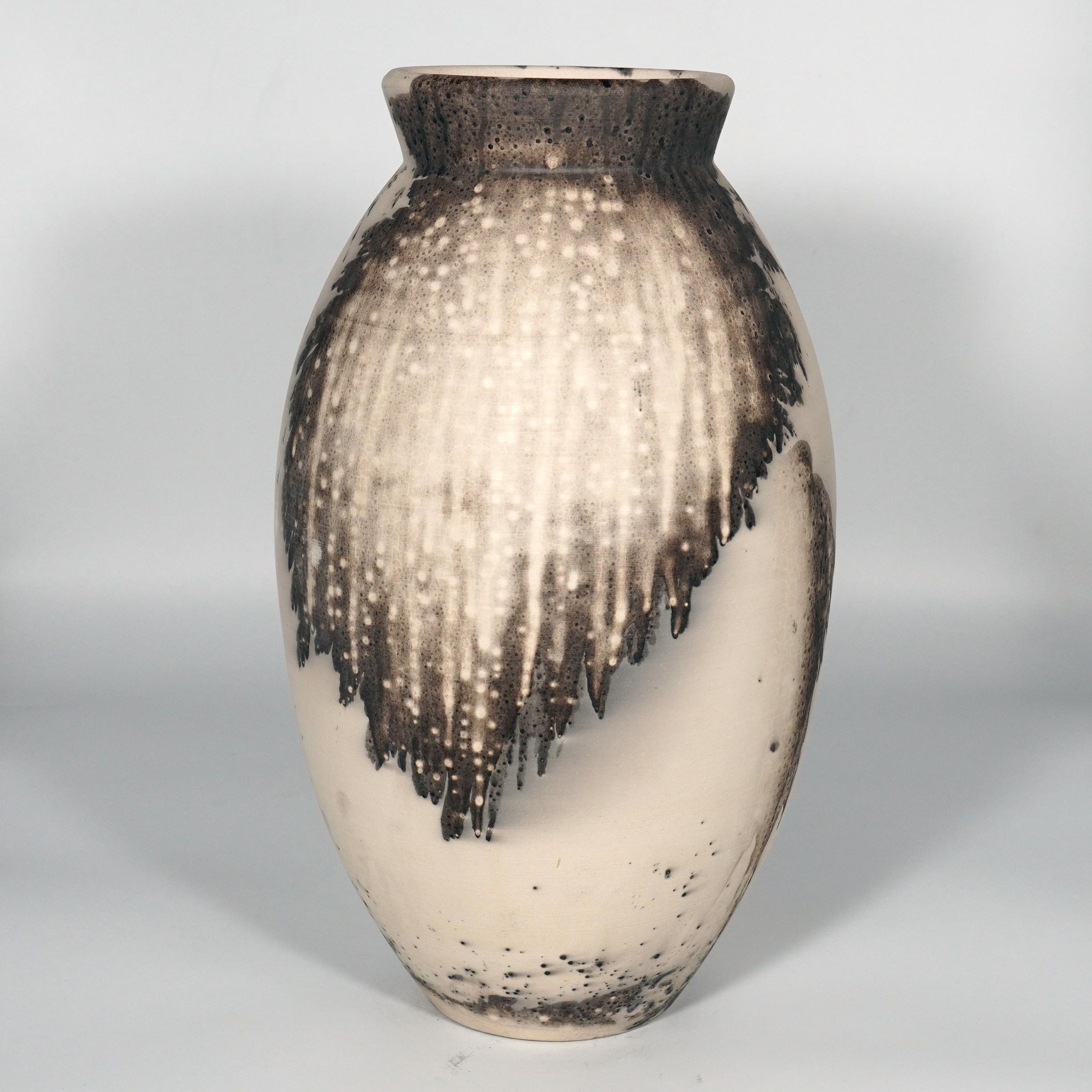 The Oval Vase is a tall, teardrop-shaped design best for adding a touch of elegance and intrigue to an interior space. Made using the Raku technique, it easily becomes a great conversation starter.

Obvara is a firing technique similar to the Raku