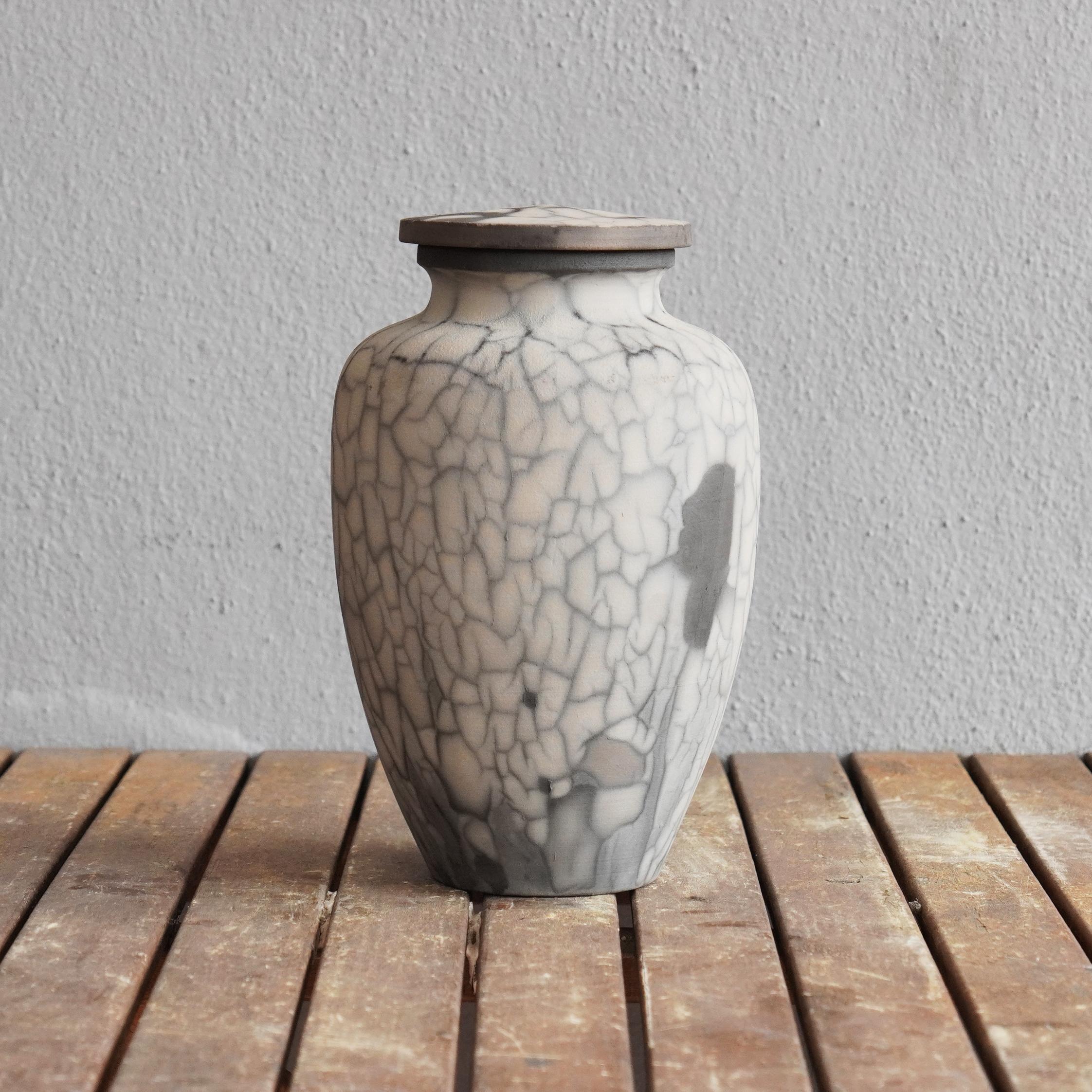 Omoide ~ (思い出) - Memories
 
 The passing of a loved one will always be a defining moment in a person's life. The Omoide Urn is a one of a kind ceramic art piece that offers a focal point to reminisce on the mememories left behind by your loved one.
