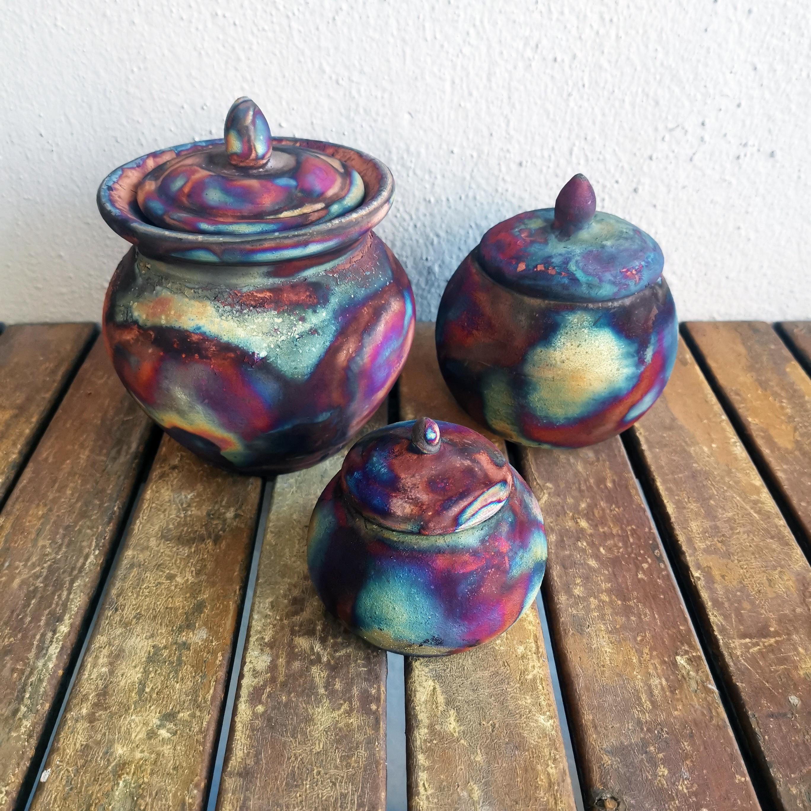 This is a set of 3 urns that are made of the following pieces :

*Heiwa - Peace*

Our Heiwa urn is a mid sized urn that has a unique lipped design where the lid goes into the body of the vase. This urn has a rounded knob cover holder and can be