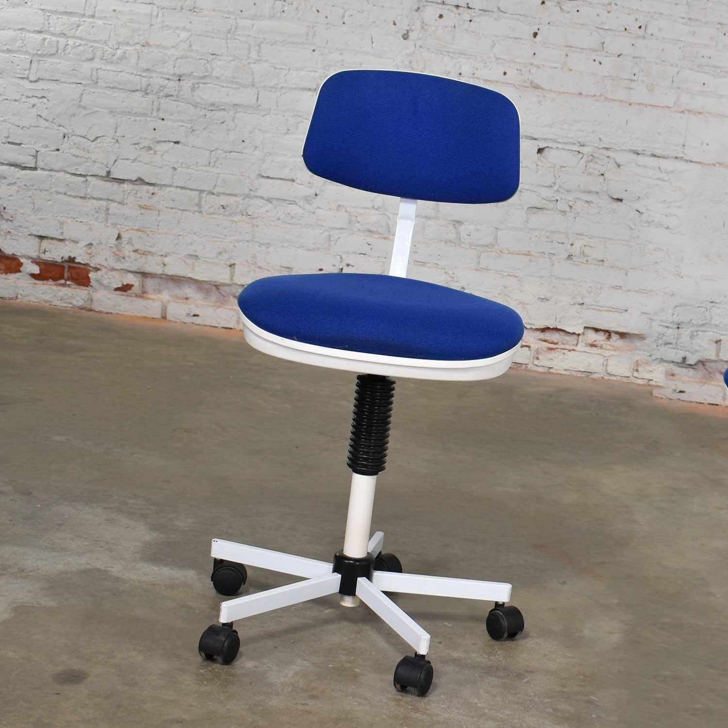 Awesome task chair by Rabami and made in Denmark in blue and white. It is attributed as being the Kevi chair designed by Jorgen Rasmussen. It is in wonderful vintage condition but not without signs of age. On the underside of its seats are repaired