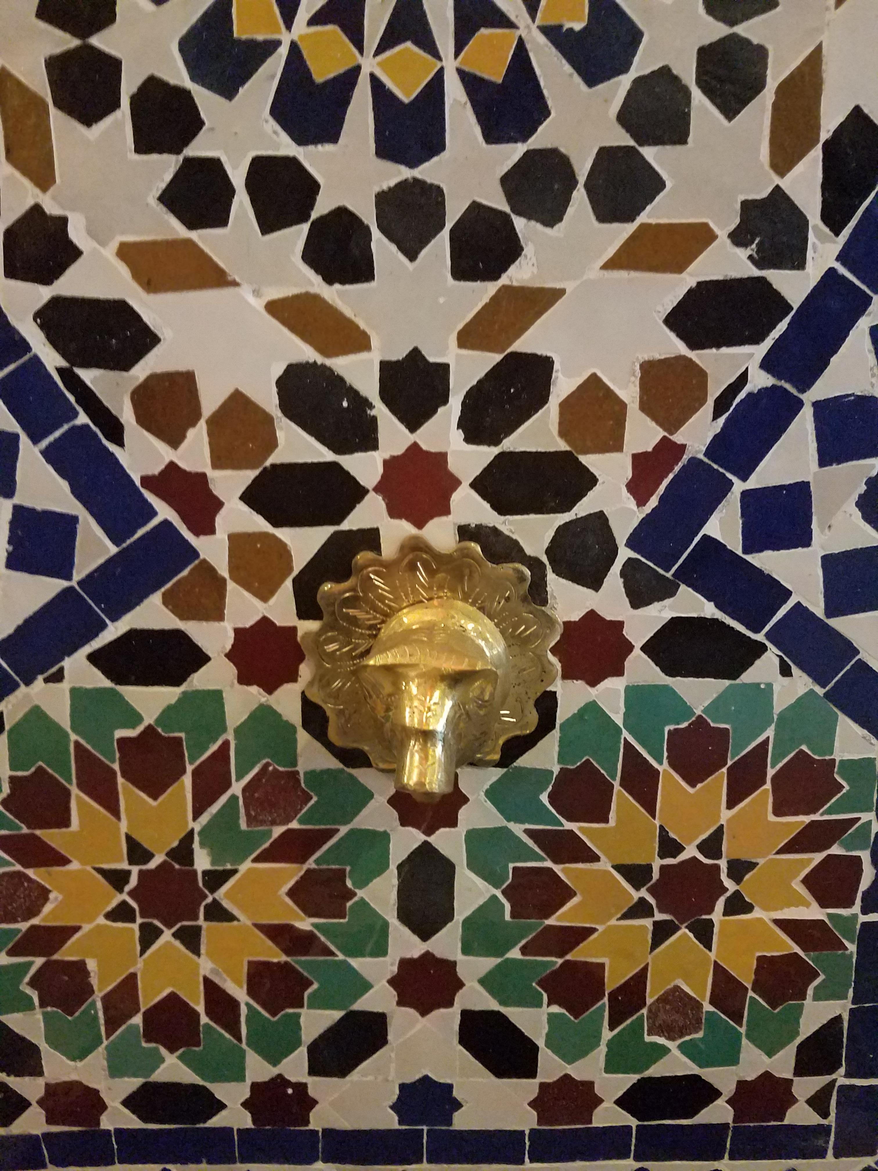Moroccan glazed multicolored (Fez tradition) fountain made in Morocco. Measures approximately 50” high and 30” wide, and comes with a copper spout and short metal feet. Great for outdoors/indoors.
A small fountain pump is also included, to make