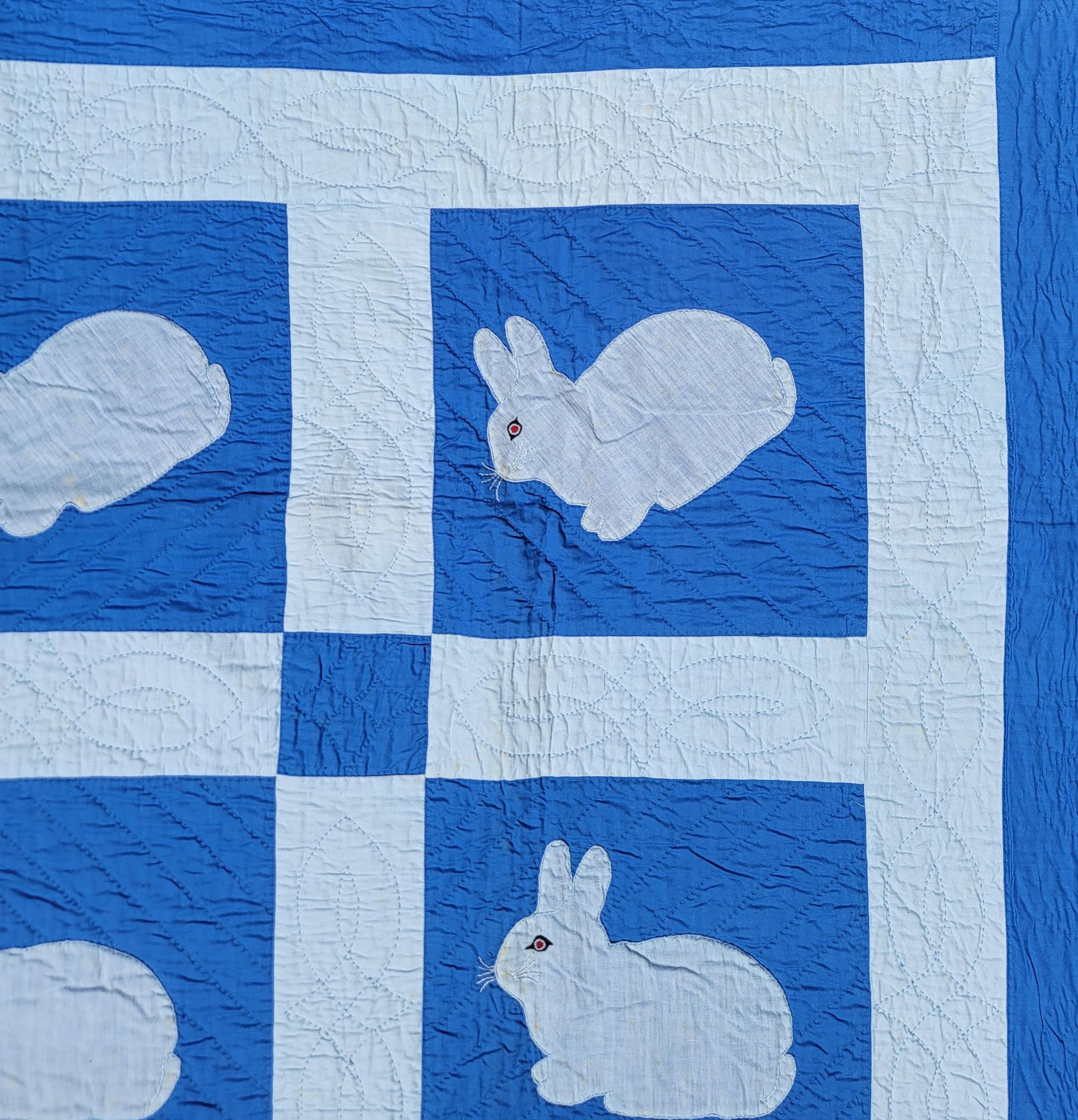 This folky rabbit applique quilt is in good condition and has hand sewn eyes. The condition is very good and nice quilting.