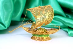 Rabelo boat in gilded filigree w/ barrels on enameled base