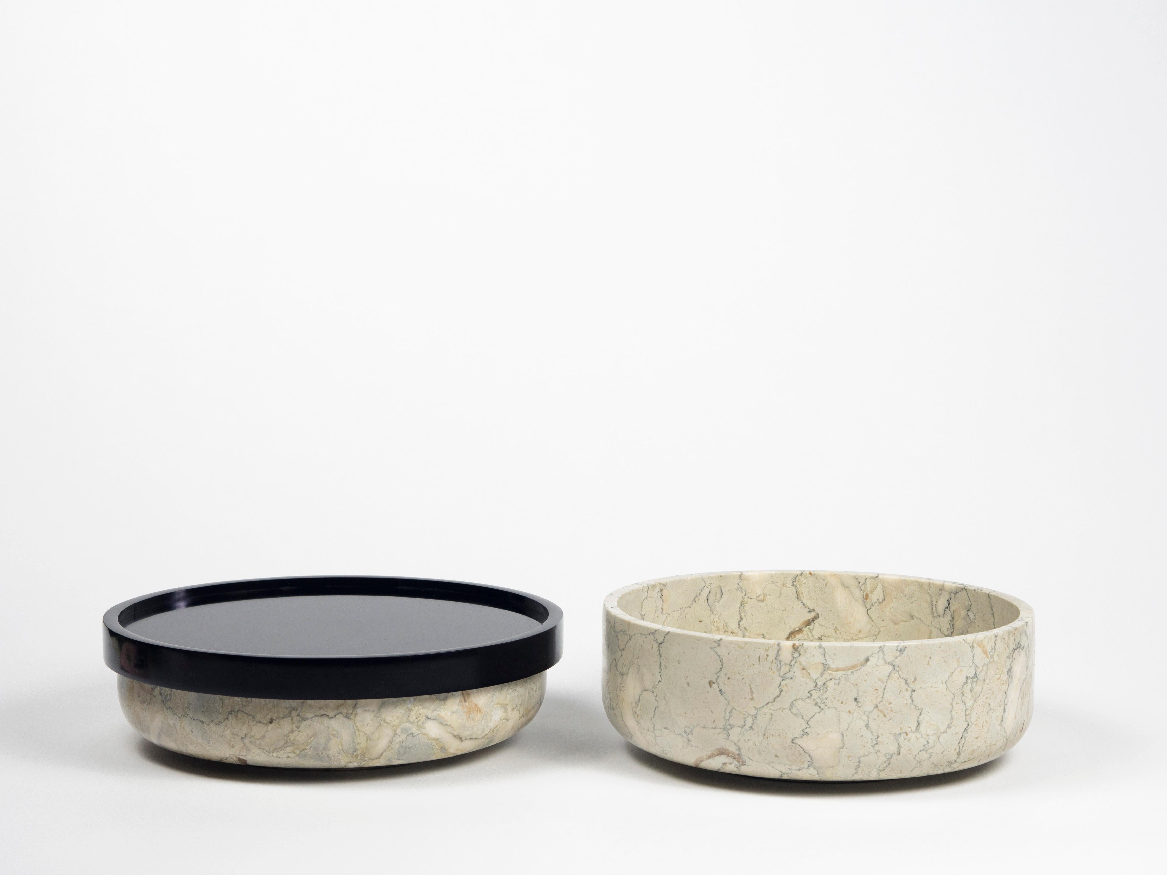A collection of marble containers made up of 2 elements and held together by a Corian element designed for everyday domestic life and ready to welcome and offer hospitality. Versatile objects that adapt to multiple uses, from simple containers for