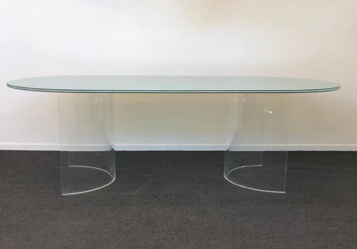 Glamorous racetrack crackle glass and clear lucite dining table designed in the 1980’s by Steve Chase. The bases have been newly professionally polished. 
The table is constructed of two 1” thick half circle acrylic bases with three layered crackle