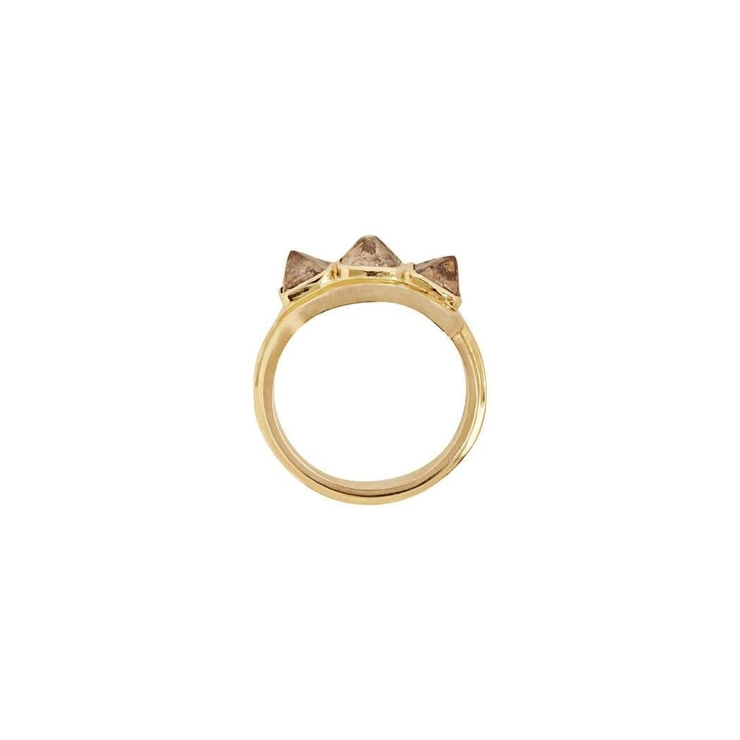 The 'Ptah' Ring is a one of a kind alternative Engagement Ring designed by Rachel Boston and made in London, England. 
This stunning ring is set with 3 cognac coloured rough diamonds which have been cleaved in the centre to give this unique pyramid