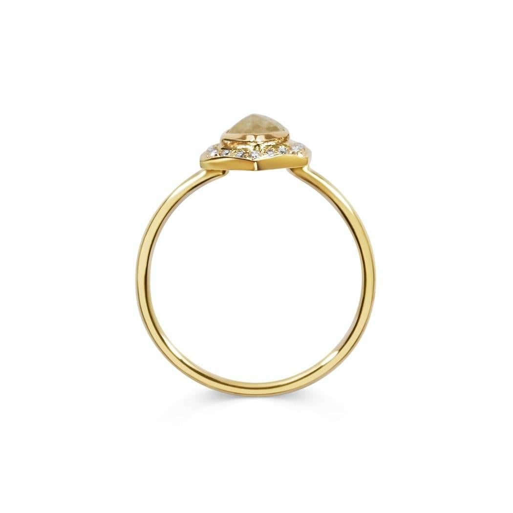 The 'Iris' Ring is a one of a kind alternative Engagement Ring designed by Rachel Boston and made in London, England. The  0.39ct Hexagon Rose cut diamond has a creamy colouring from the the diamond's natural inclusions, making it a beautiful