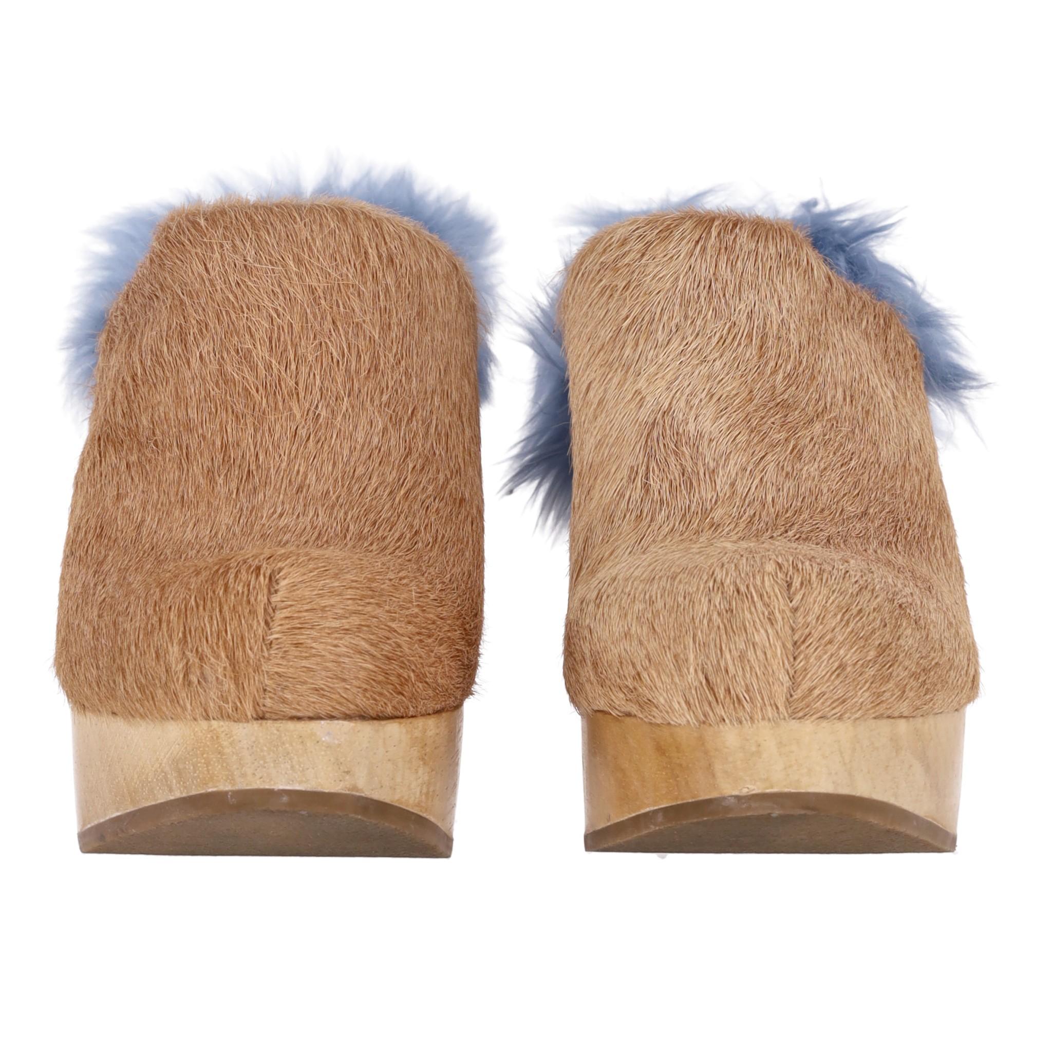 Rachel Comey Cow Hair & Alpaca Fur Clogs

Wooden platform 'Dakota' mules designed with cow hair upper in camel.

Featuring blue fur detailing to the heel and rubber soles. Rrp Approx. £450

Size – 40.5

Condition – Good/Very Good (Scratches to the
