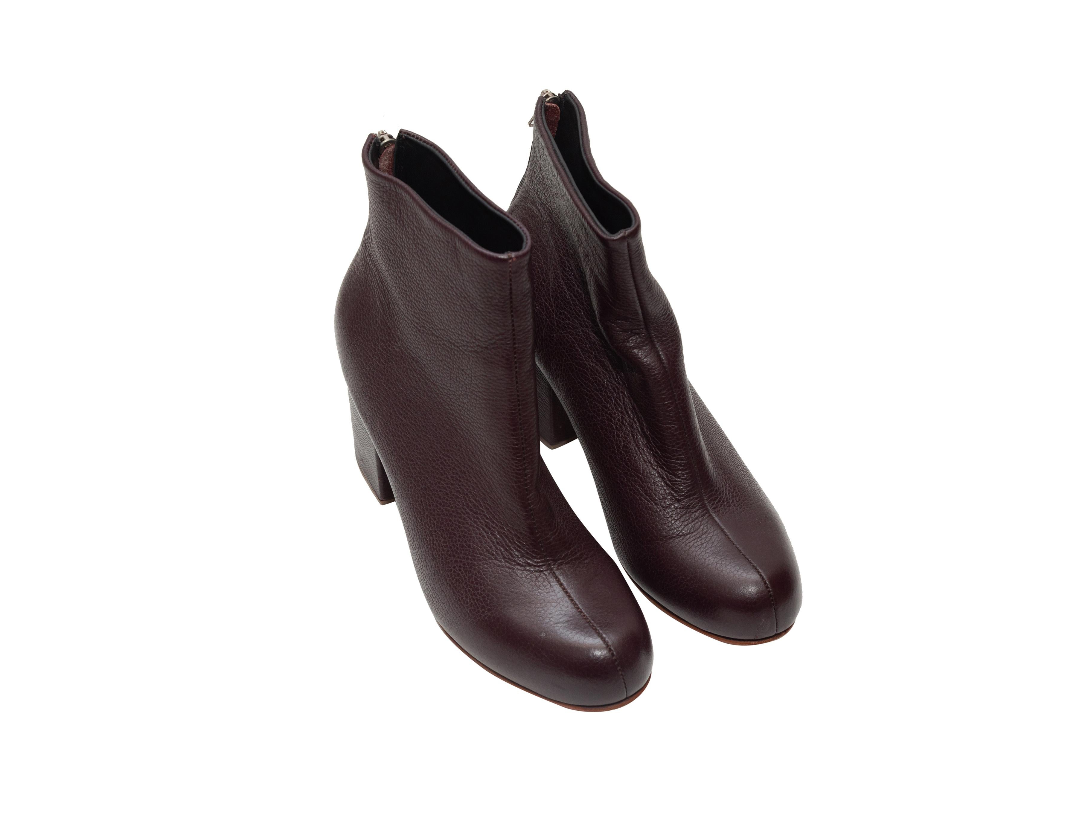 Product details: Dark burgundy leather ankle boots by Rachel Comey. Block heels. Zip closures at counters. 3