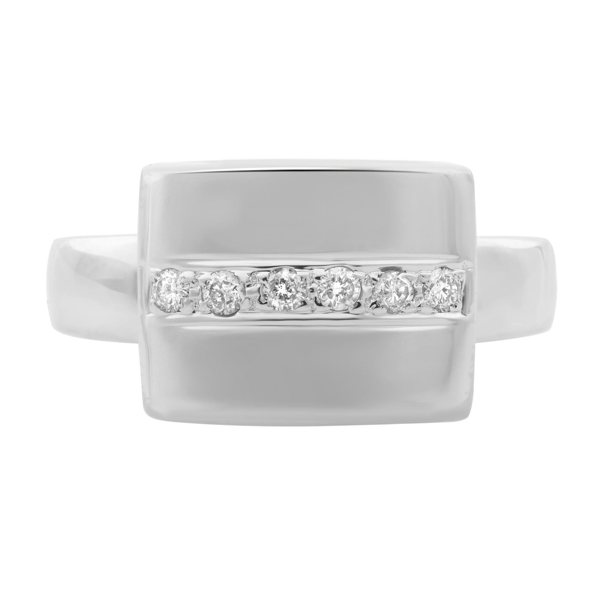 This elegant and classic diamond ring is crafted in 18k white gold. Features a center line of tiny pave set 6 round brilliant cut diamonds with a total carat weight of 0.10. Diamond color H and I clarity. Ring size: 6.75. Total weight: 6.78 grams.