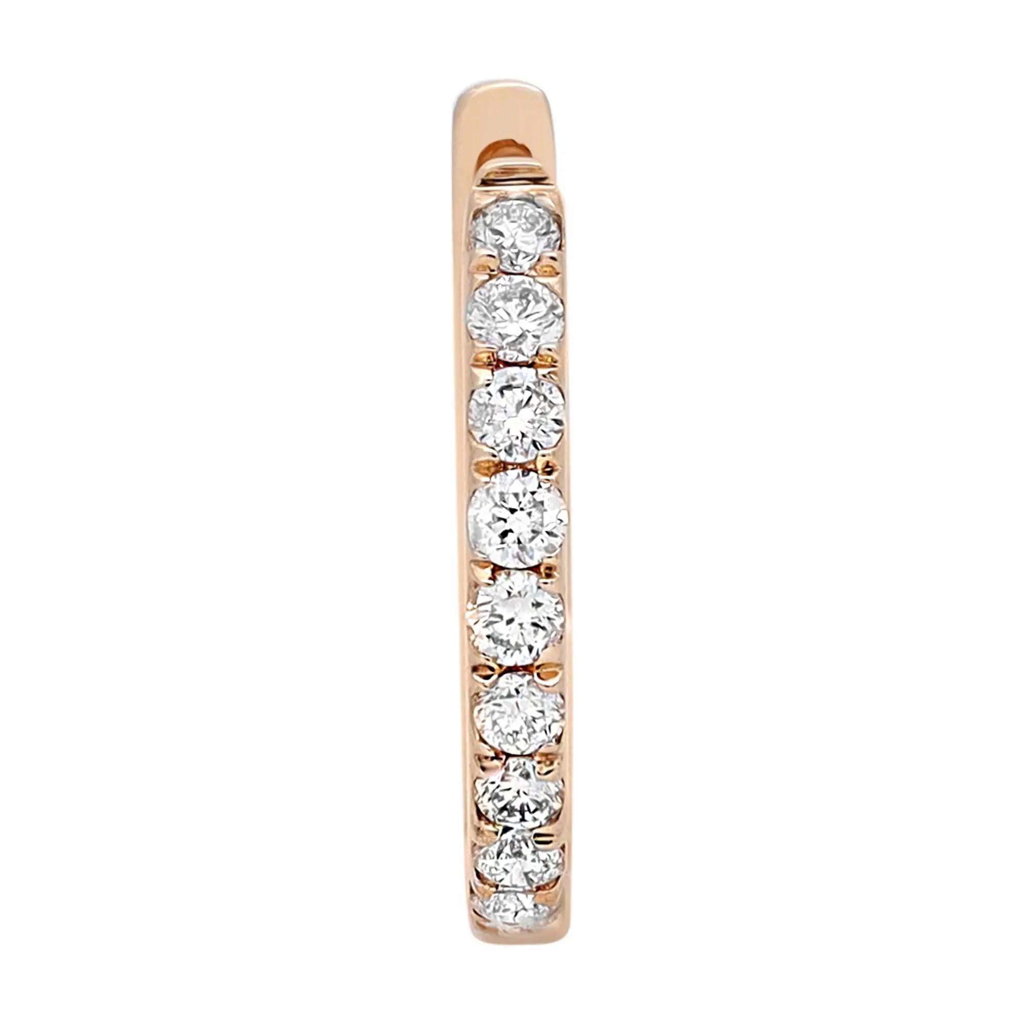 Sleek and classic, these timeless diamond huggie earrings are perfect for a great everyday look. Featuring a row of prong set bright white round cut diamonds set in lustrous 14K yellow gold. Total diamond weight: 0.21 carat. Diamond quality: Color