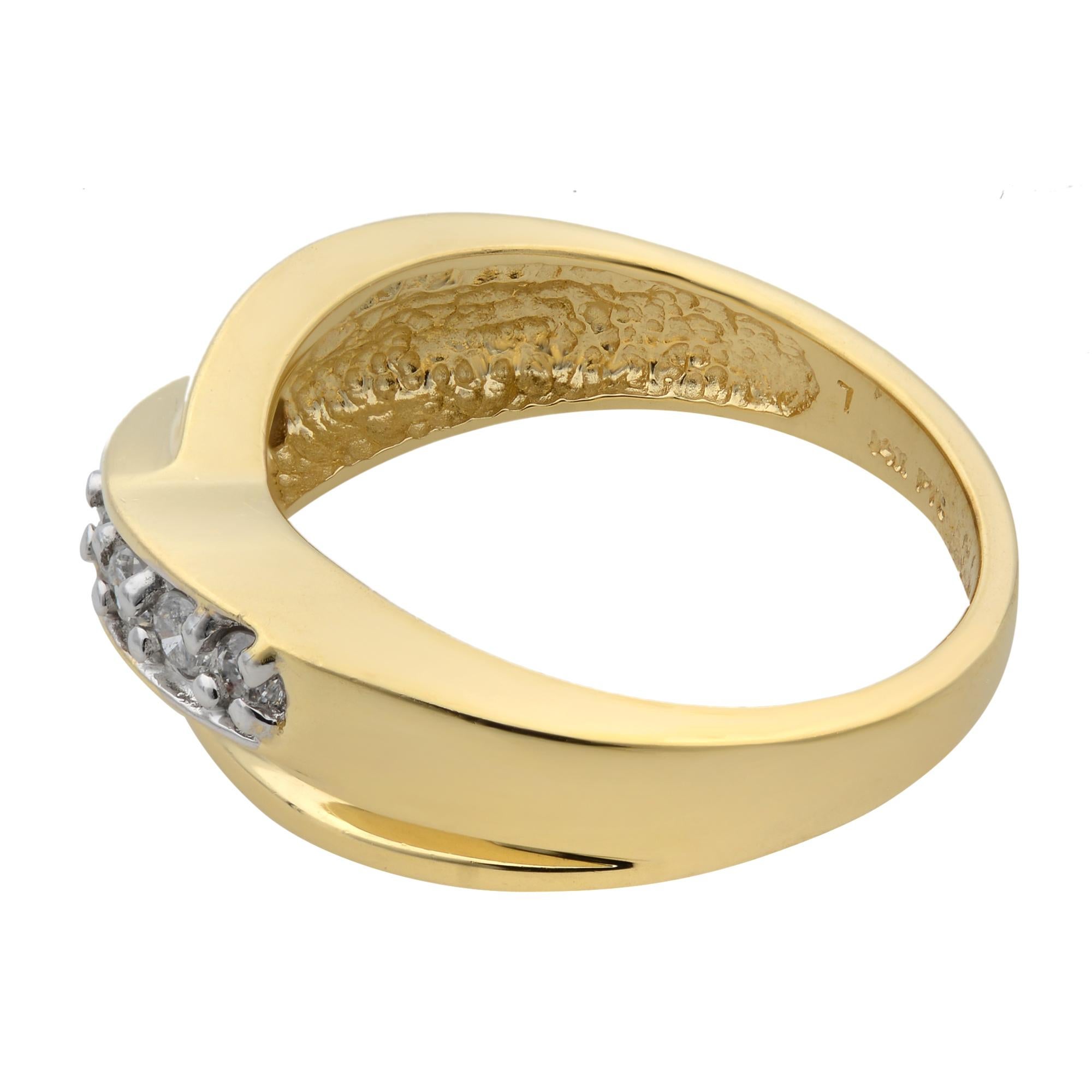This beautiful crisscross band ring is crafted in 14k yellow gold and encrusted with round brilliant cut diamonds weighing 0.25 carats. Diamond quality: color H and clarity SI-I. Ring size: 7. Band width: 6.5mm. Total weight: 5.22 grams. Great