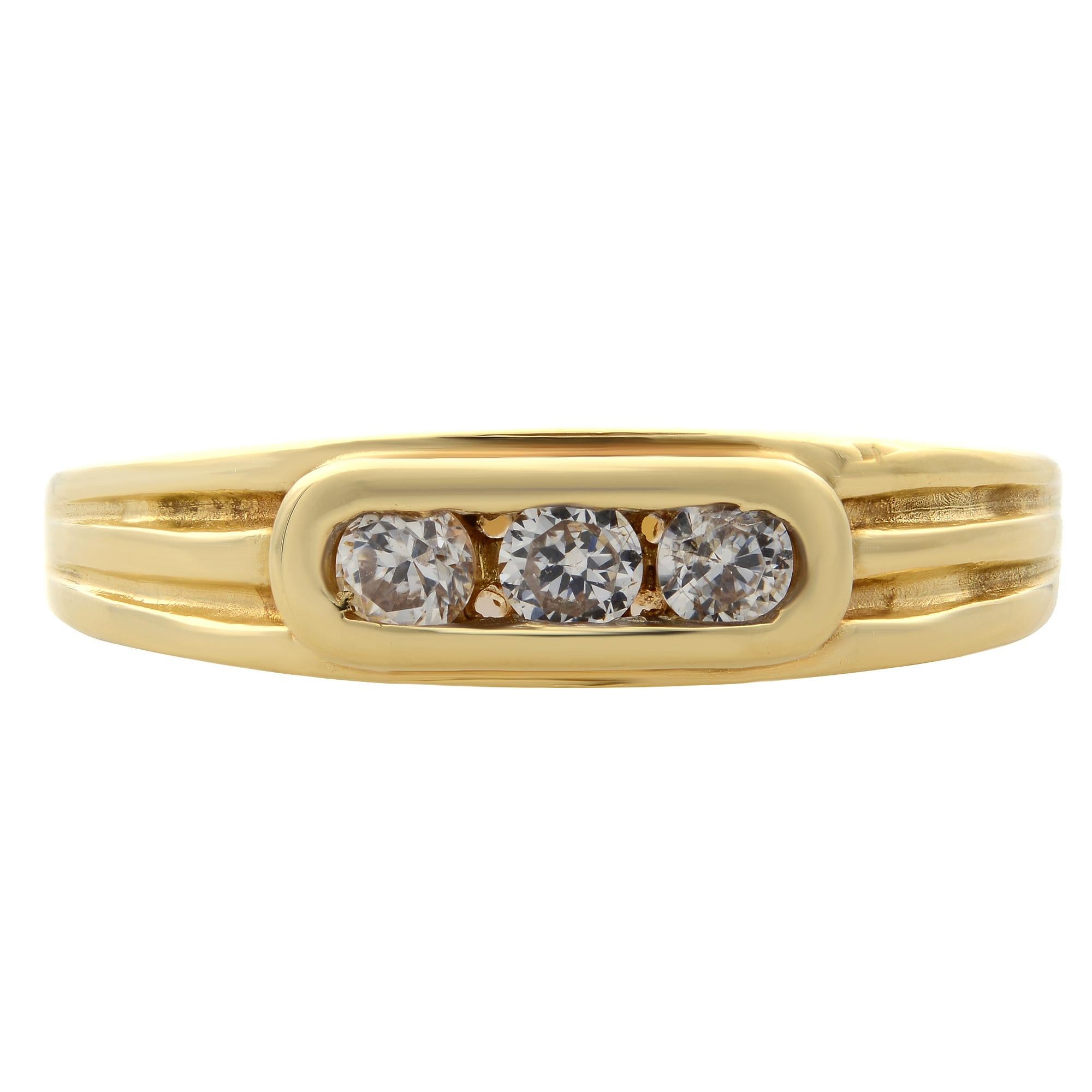 Simple and classic, this channel set diamond band ring is crafted in 14k yellow gold. It features channel set 3 round brilliant cut diamonds weighing 0.25 carat. Diamond color G-H and SI clarity. Ring width: 5.15mm. Ring size: 9.75. Total weight: