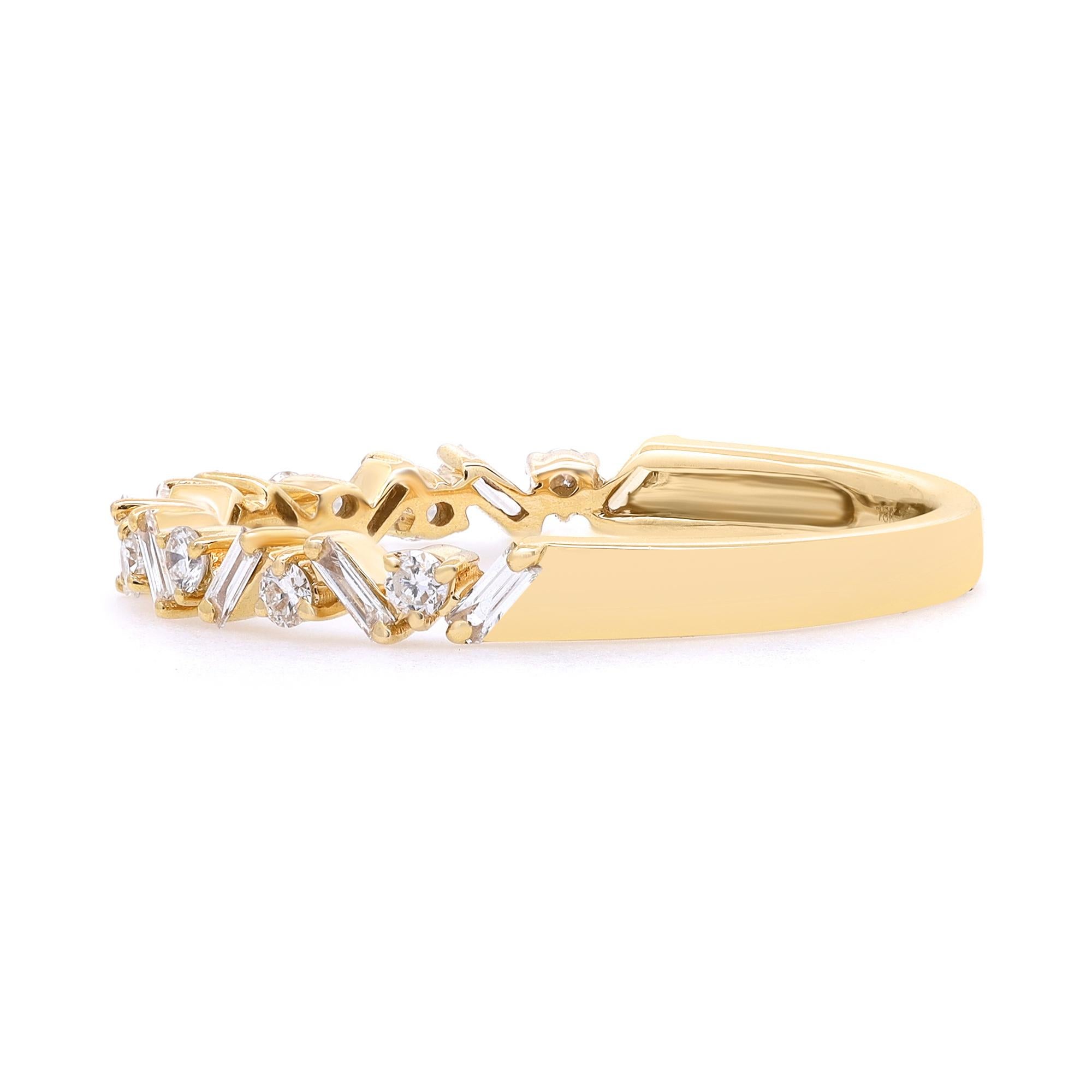 Simple and delicate diamond ring crafted in 18k yellow gold. This ring features prong set baguette cut diamonds set in a zig-zag pattern portraying a timeless, eye-catching style. It's stackable and easy to mix and match. Total diamond weight: