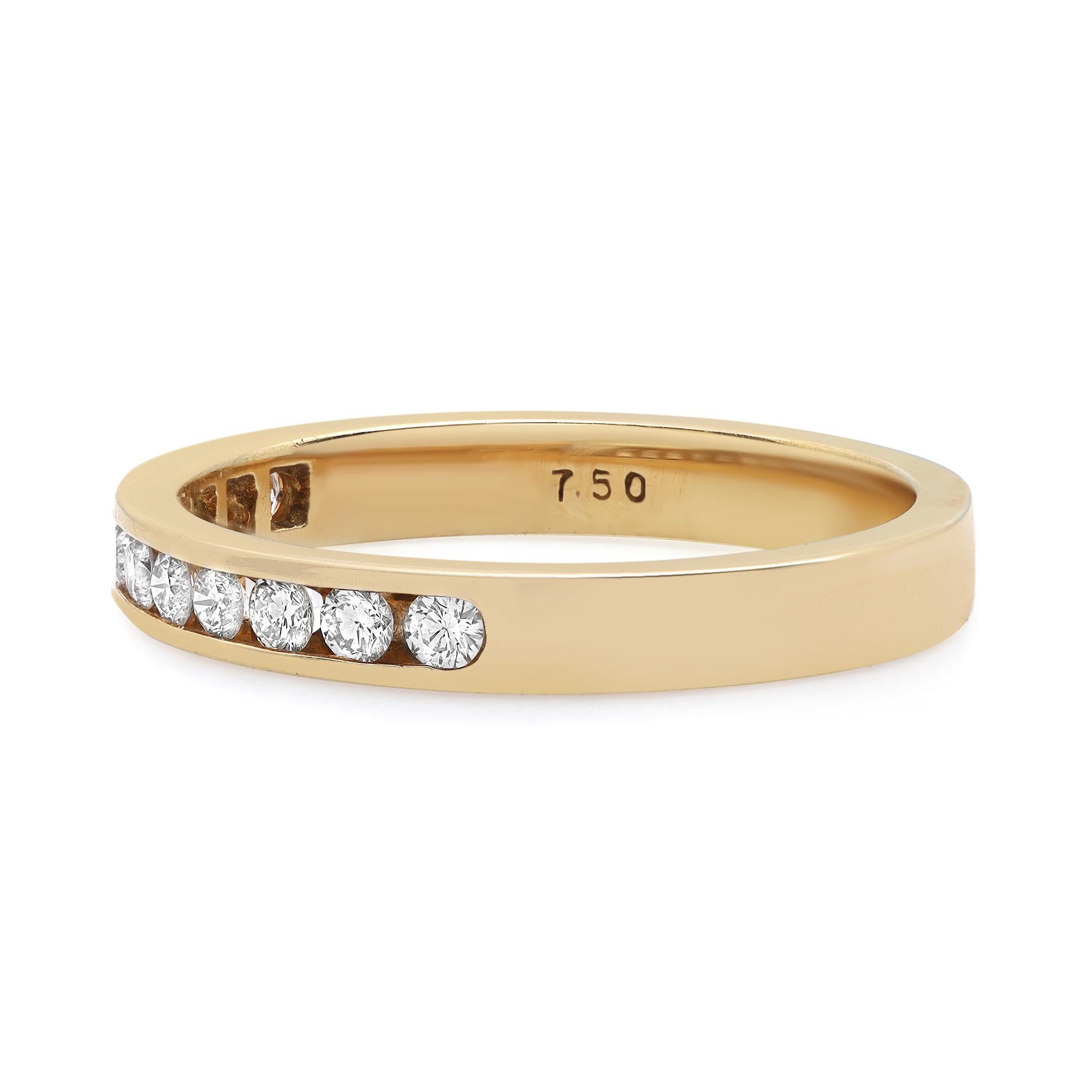 This beautiful diamond wedding band ring is a perfect fit for any occasion. Crafted in fine 18K yellow gold. It features 11 channel set round brilliant cut diamonds weighing 0.32 carat encrusted halfway through the band. Diamond color G-H and VS-SI