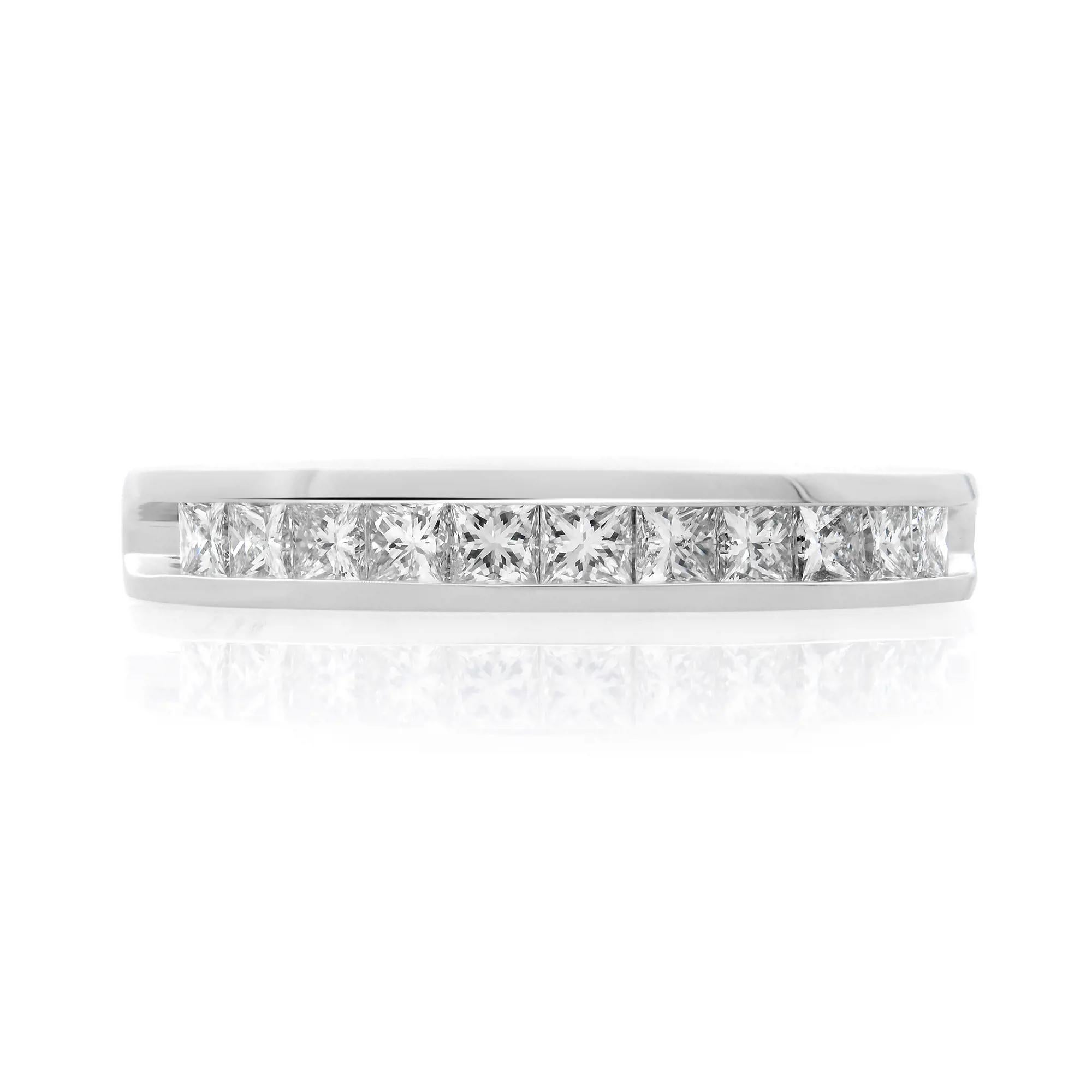 This beautiful and classic ladies wedding band ring features 11 princess cut dazzling diamonds. All diamonds are channel set in a solid platinum setting. Total diamond weight: 0.50 carat. Diamond color G-H and VS-SI clarity. Band width: 3.3 mm. Ring