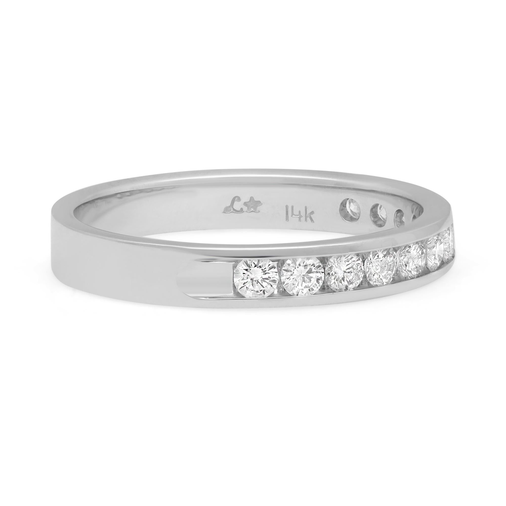 Timeless and stylish diamond wedding band ring. Crafted in fine high polished 14k white gold. This ring features 12 dazzling round brilliant cut diamonds in channel setting. Perfect for a gift or as a promise ring. Total diamond weight: 0.60 carat.