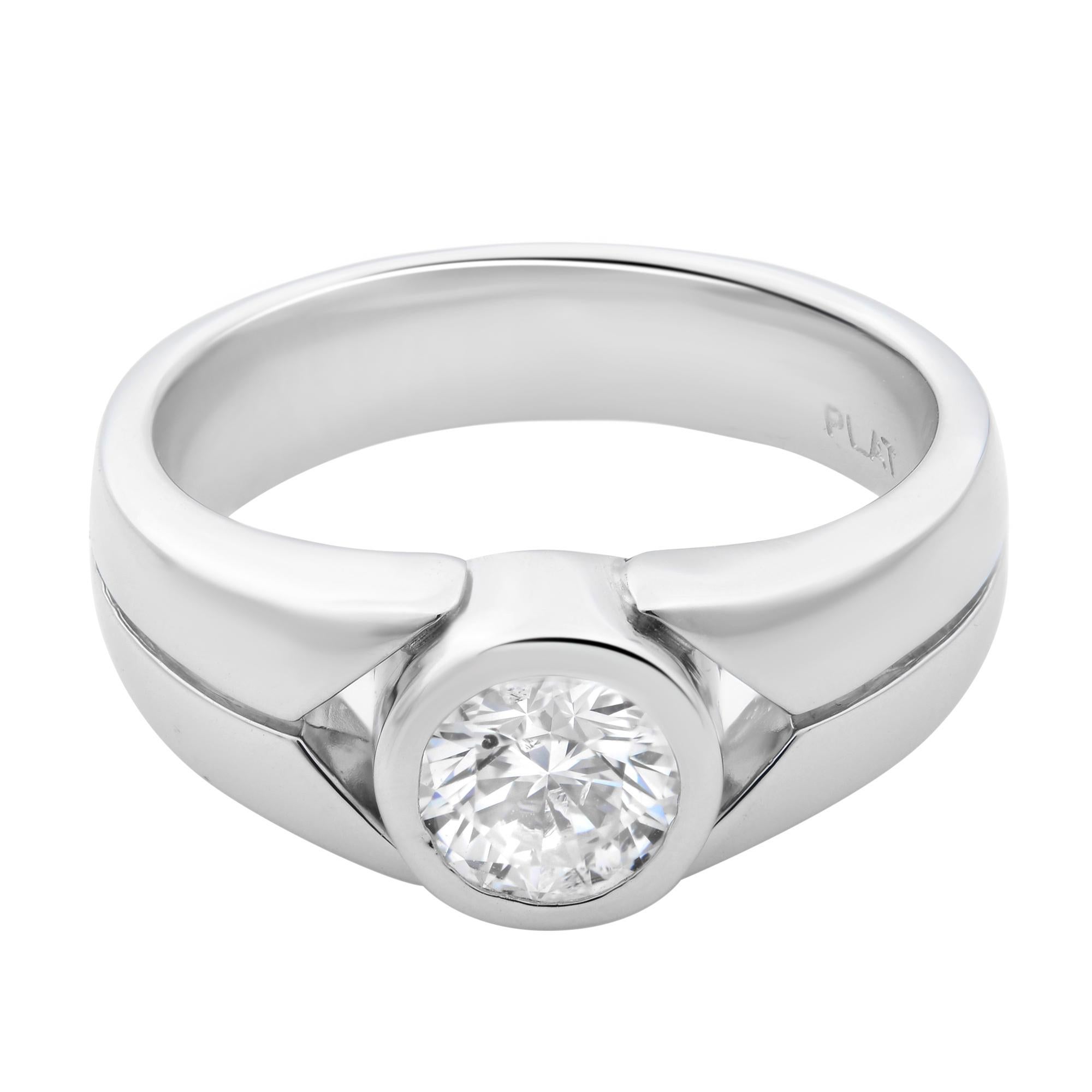 This elegant and classic diamond engagement ring is crafted in highly polished platinum. Features a bezel set round brilliant cut diamond with a total carat weight of 0.75. Diamond color H and SI1 clarity. Band width: 5.2 mm. Ring size: 5.75. Total