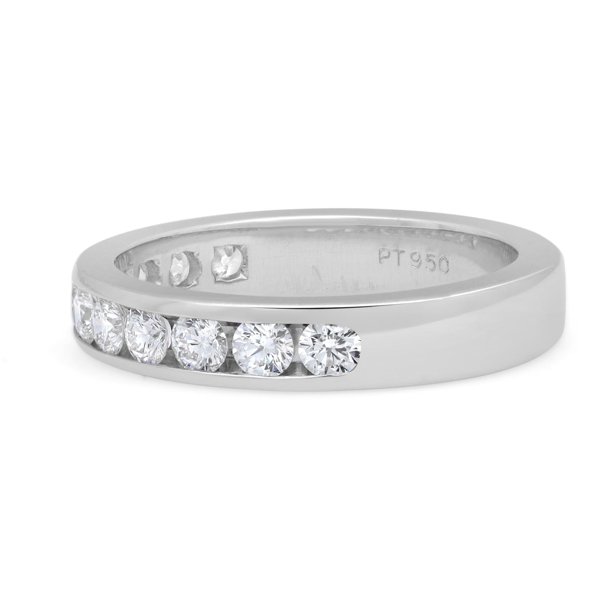 This classic women's eternity band ring features 11 bright white round brilliant cut dazzling diamonds. All diamonds are channel set in a solid platinum setting. Total diamond weight: 0.79 carat. Diamond color G-H and SI2 clarity. Ring Size 6.75.