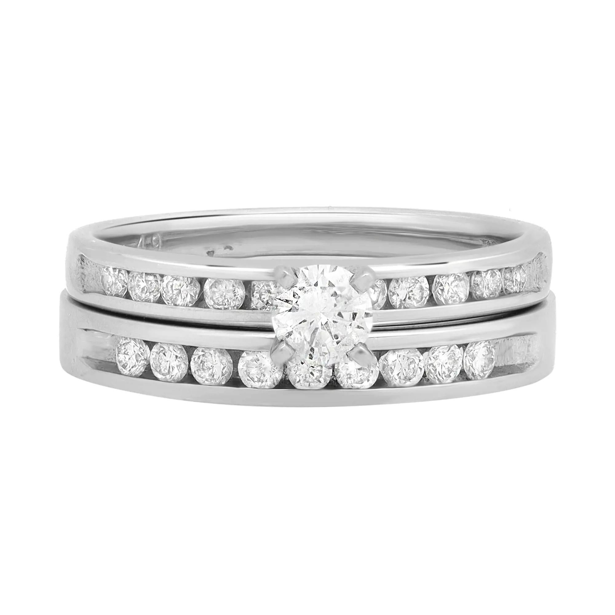 This beautiful bridal ring set is a combination of an engagement ring and a wedding band. Simple and chic, it is a beautiful reminder of your timeless love. Set in high polished platinum, the classic engagement ring is encrusted with a prong set