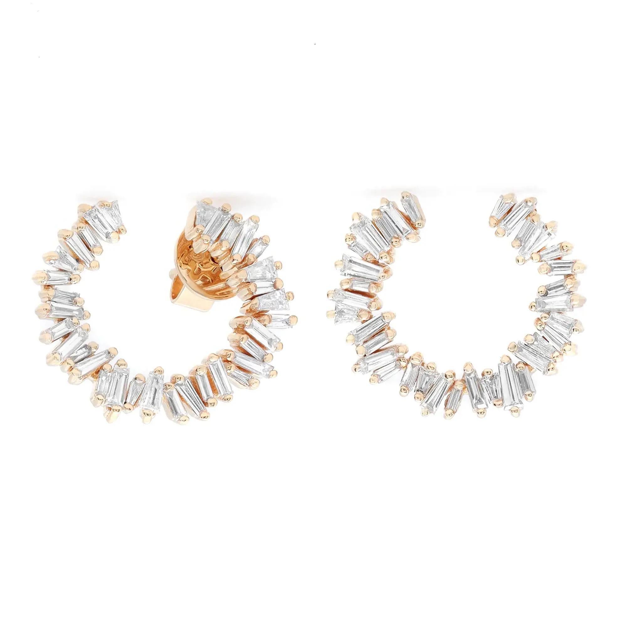 Elevate your attire with these dazzling diamond stud earrings. Crafted in fine 18K yellow gold. These earrings feature prong set baguette cut diamonds set in a C-shaped shank. Total diamond weight: 0.94 carat. Diamond quality: color G-H and clarity